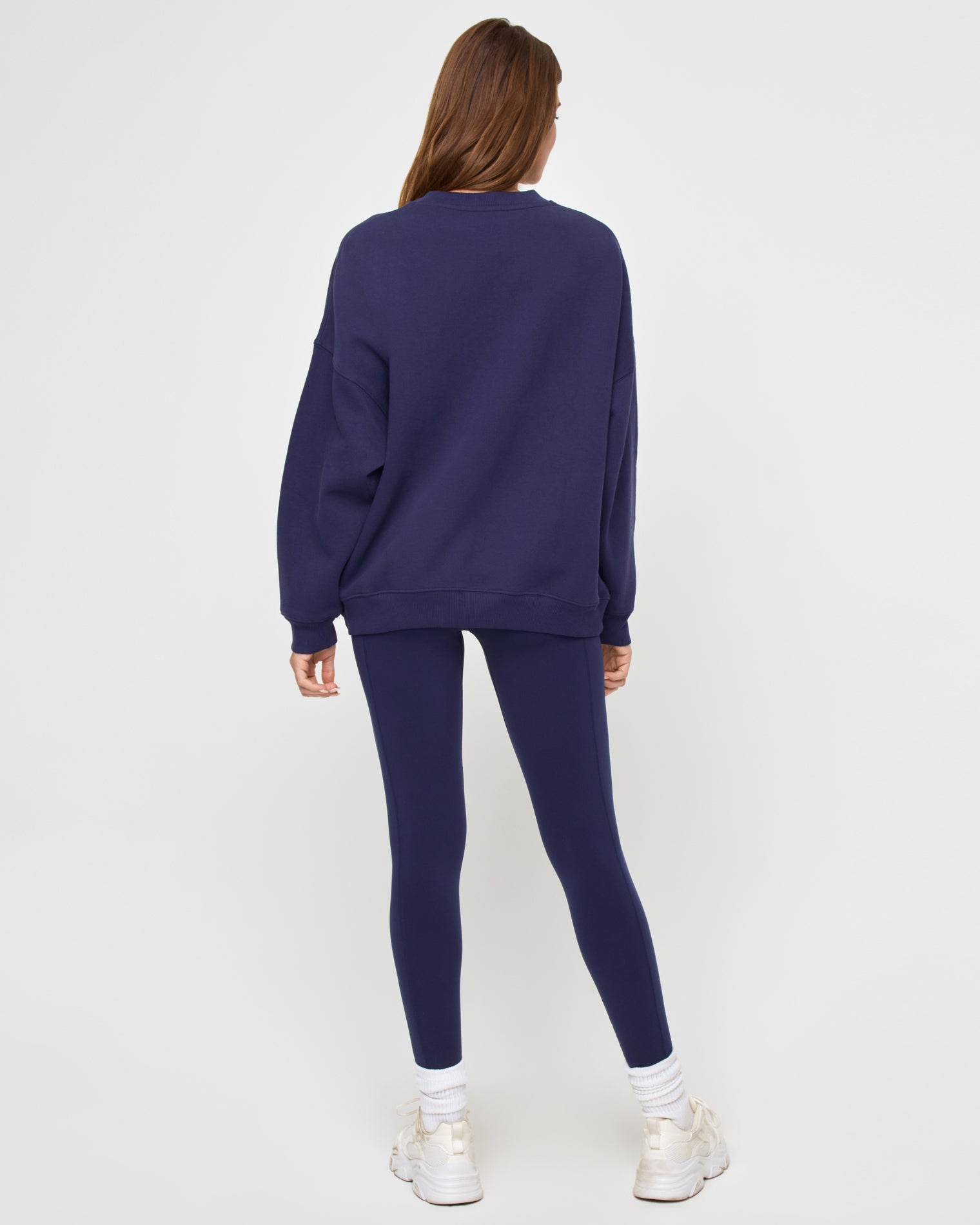 Legend Sweatshirt - Midnight Blue Back view of the LSPACE Legend Sweatshirt in midnight blue on a model against a light background, showing the oversized sweatshirt.