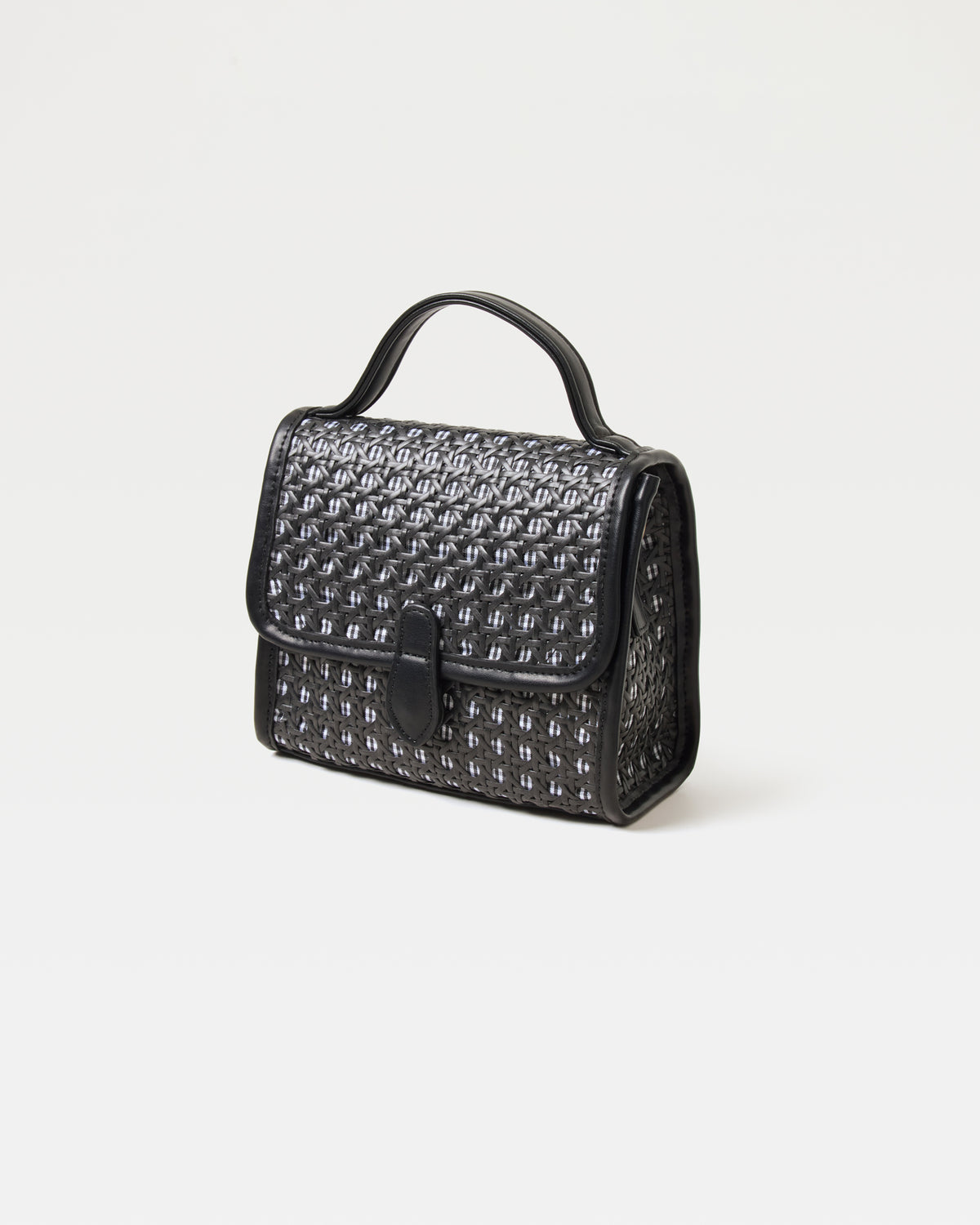 Front view of the Amelia Bag in black showing the woven raffia texture and flap closure.