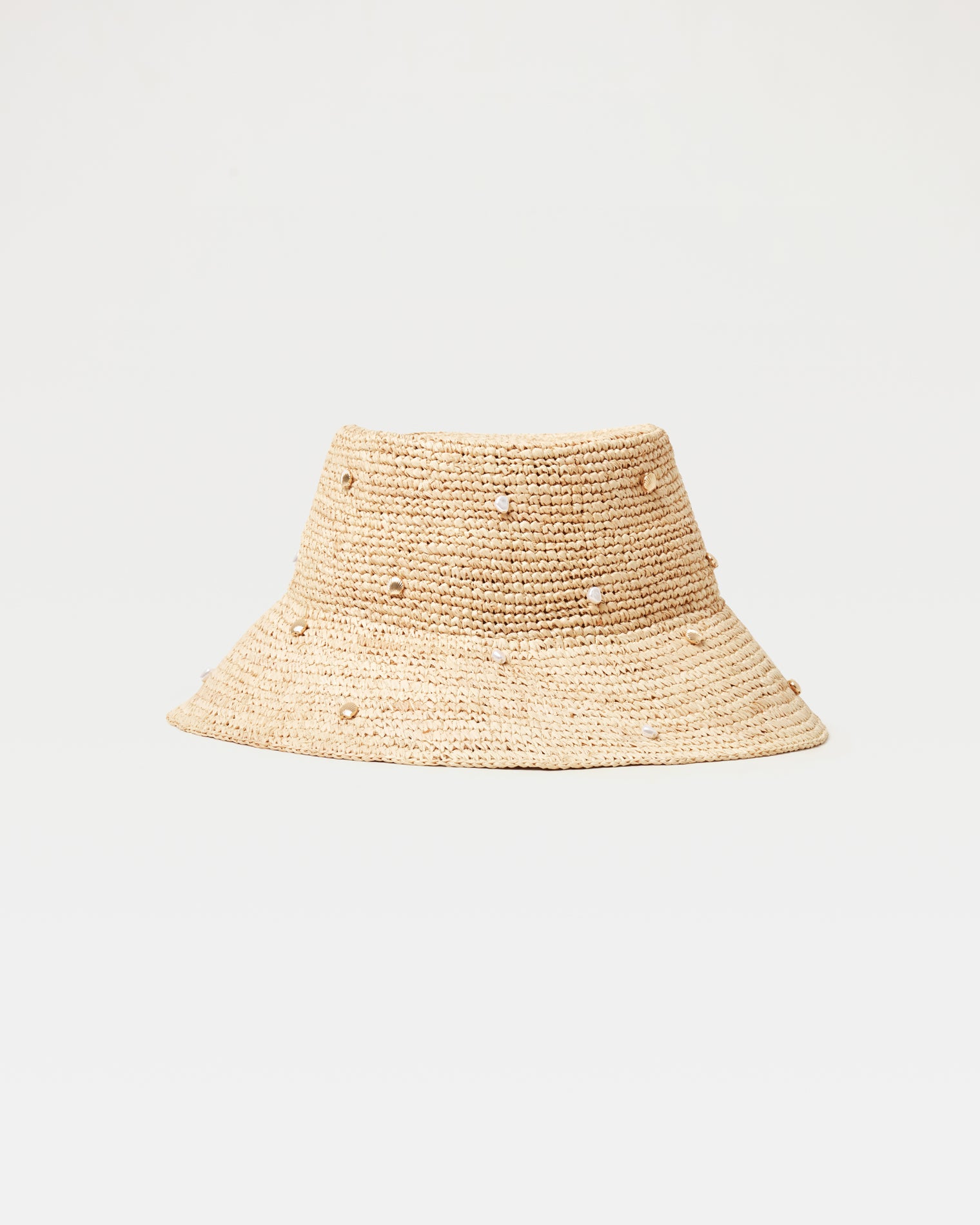 Carmel Island Hat - Natural Off-model front view of the Carmel Island Hat in natural, a woven raffia bucket hat with scattered pearl embellishments, on a white background.