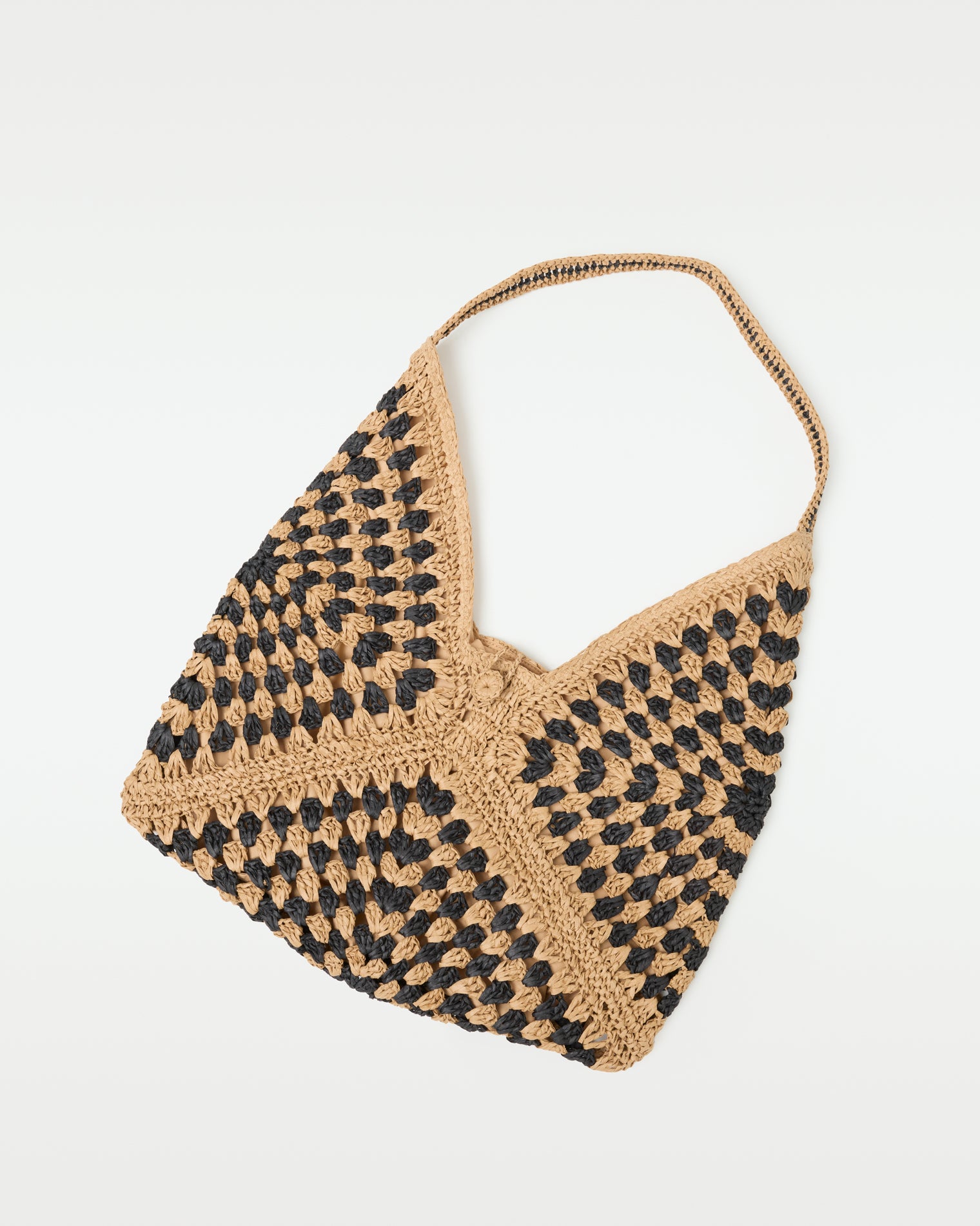 Coastline Beach Bag - Natural Black Flat lay of the natural black Coastline Beach Bag showing the open-top crochet tote construction.