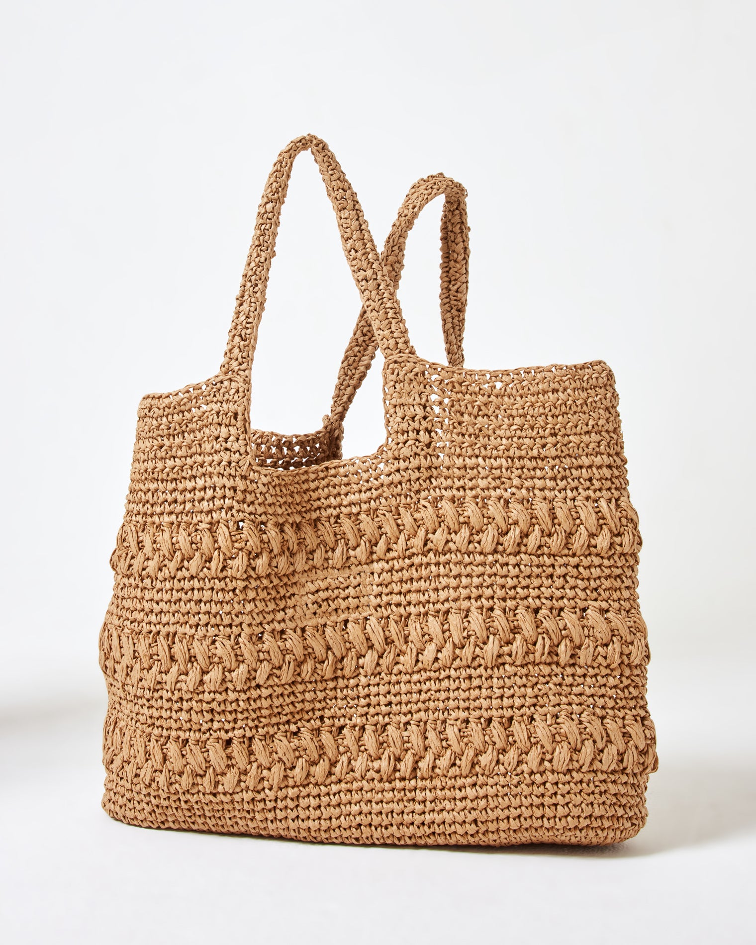 Changing Tides Bag - Natural Back view of the Changing Tides Bag in natural showing the crochet woven texture and two handles.