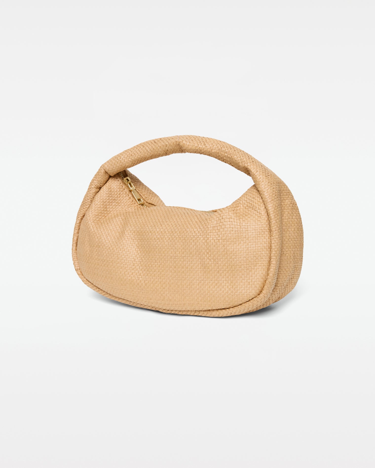 Mendoza Bag - Natural Angled view of the Mendoza Bag in natural showing the woven raffia texture, gold zipper closure, and curved handle.