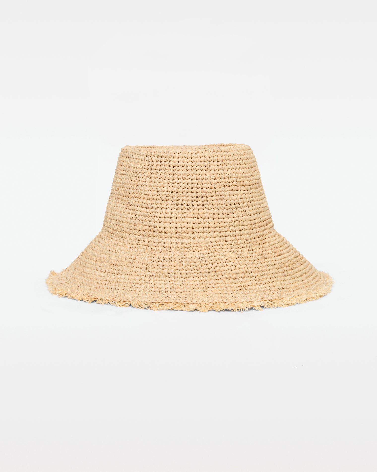 Paco Bucket Hat - Natural Off-model front view of the Paco Bucket Hat in natural, a crochet raffia bucket hat with a frayed raw edge brim, on a white background.