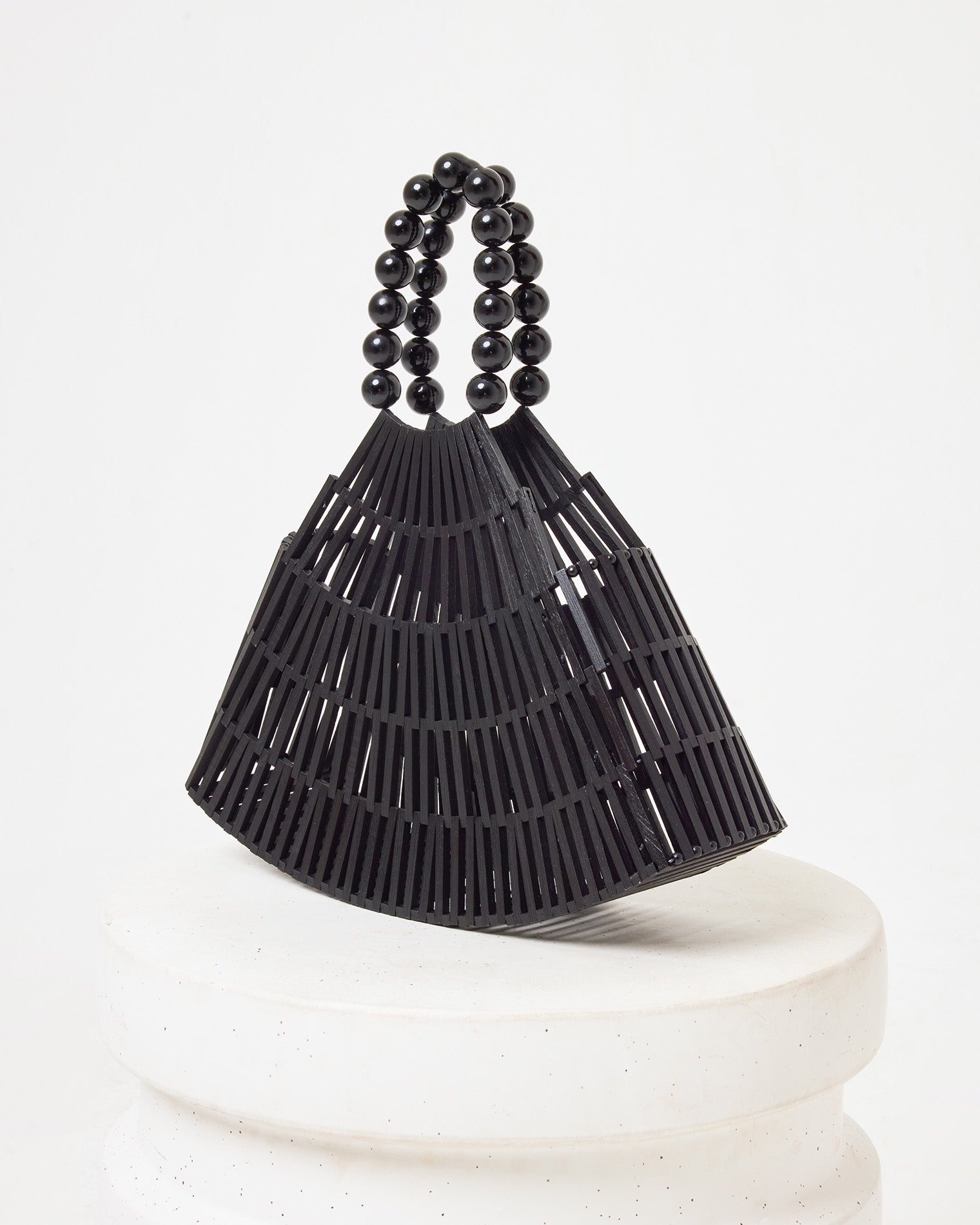 Starlight Bag - Black Side view of the Starlight Bag in black on a white pedestal.