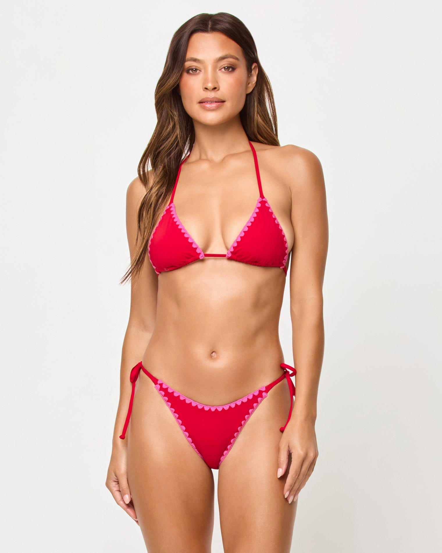 Zahra Bikini Bottom - Lipstick Red Sweetheart Front view of model wearing the LSPACE Zahra Bikini Top in lipstick red, a triangle halter top with pink sweetheart scallop trim, paired with matching Zahra Bikini Bottom.