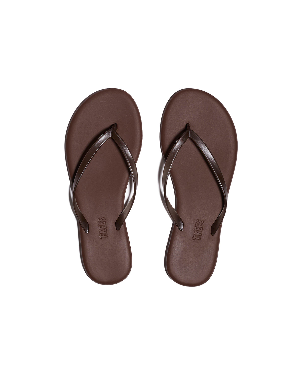 TKEES Aqua Sandals - Brown Top-down view of both brown TKEES Aqua Sandals with slim thong strap and TKEES logo on footbed.