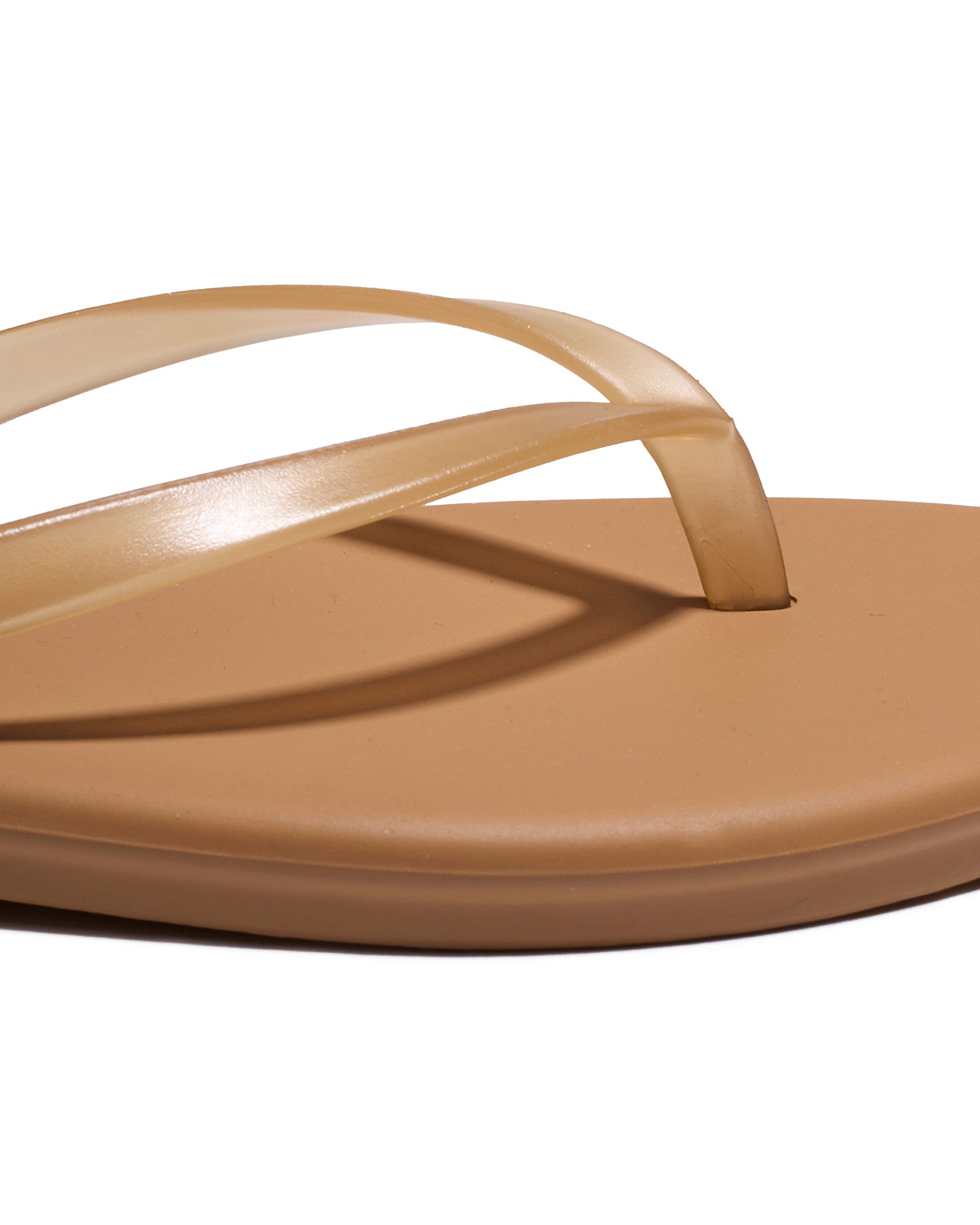 TKEES Aqua Sandals - Tan Close-up of the tan leather thong strap and footbed detail on the TKEES Aqua Sandals.