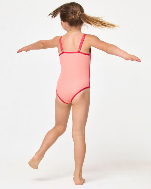 LSPACE Beach Skipper one piece in Fresh Squeezed Pout, back view on model.
