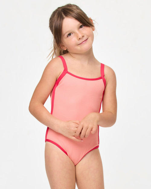 LSPACE Beach Skipper one piece in Fresh Squeezed Pout, front view on model.