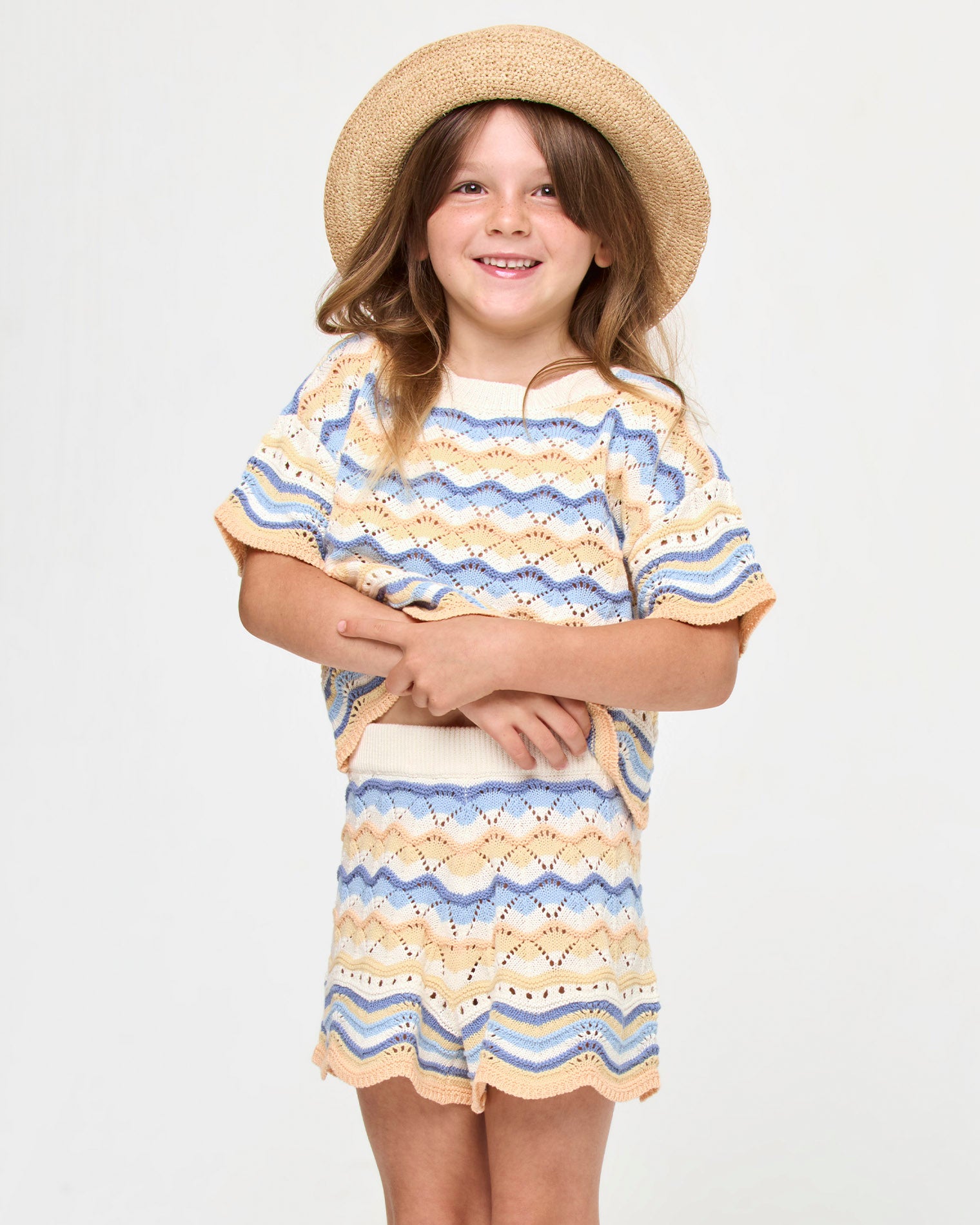 Isadora Mini Bucket Hat - Natural LSPACE Isadora mini bucket hat in natural, front view on model.