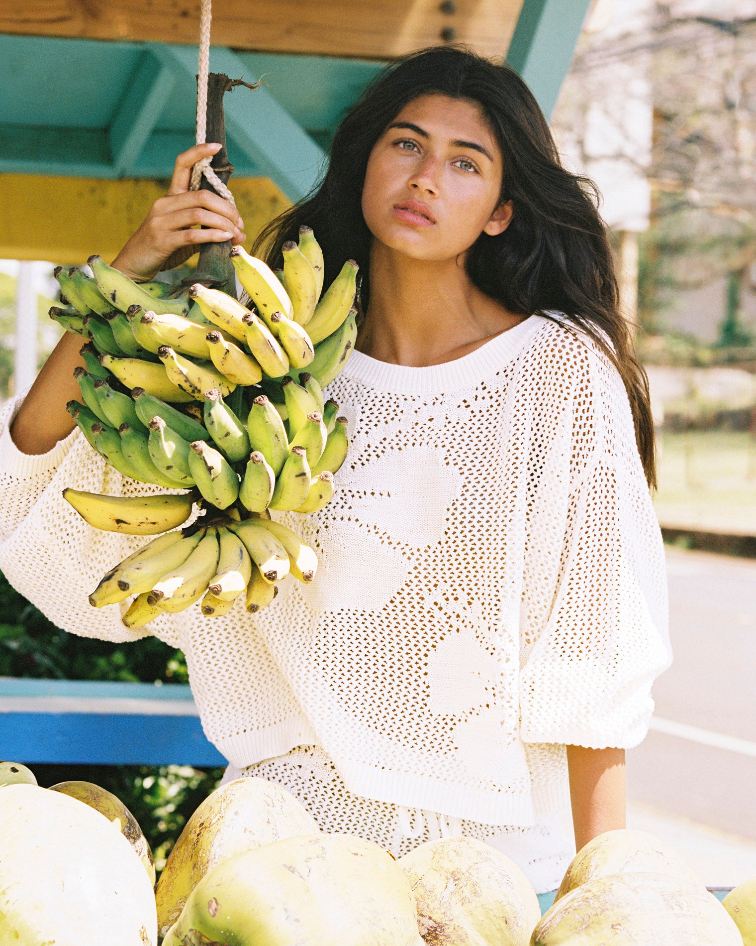 Island Time Sweater - Cream Cream | Badge:New Arrival_#B2AC88_#ffffff'
Model wearing the Island Time Sweater and Short posing with a bunch of bananas.