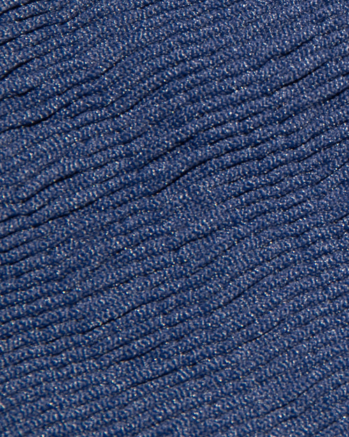 Close-up fabric detail of the LSPACE Midnight Blue pucker swimwear fabric, showing navy diagonal ribbing with subtle metallic shimmer.