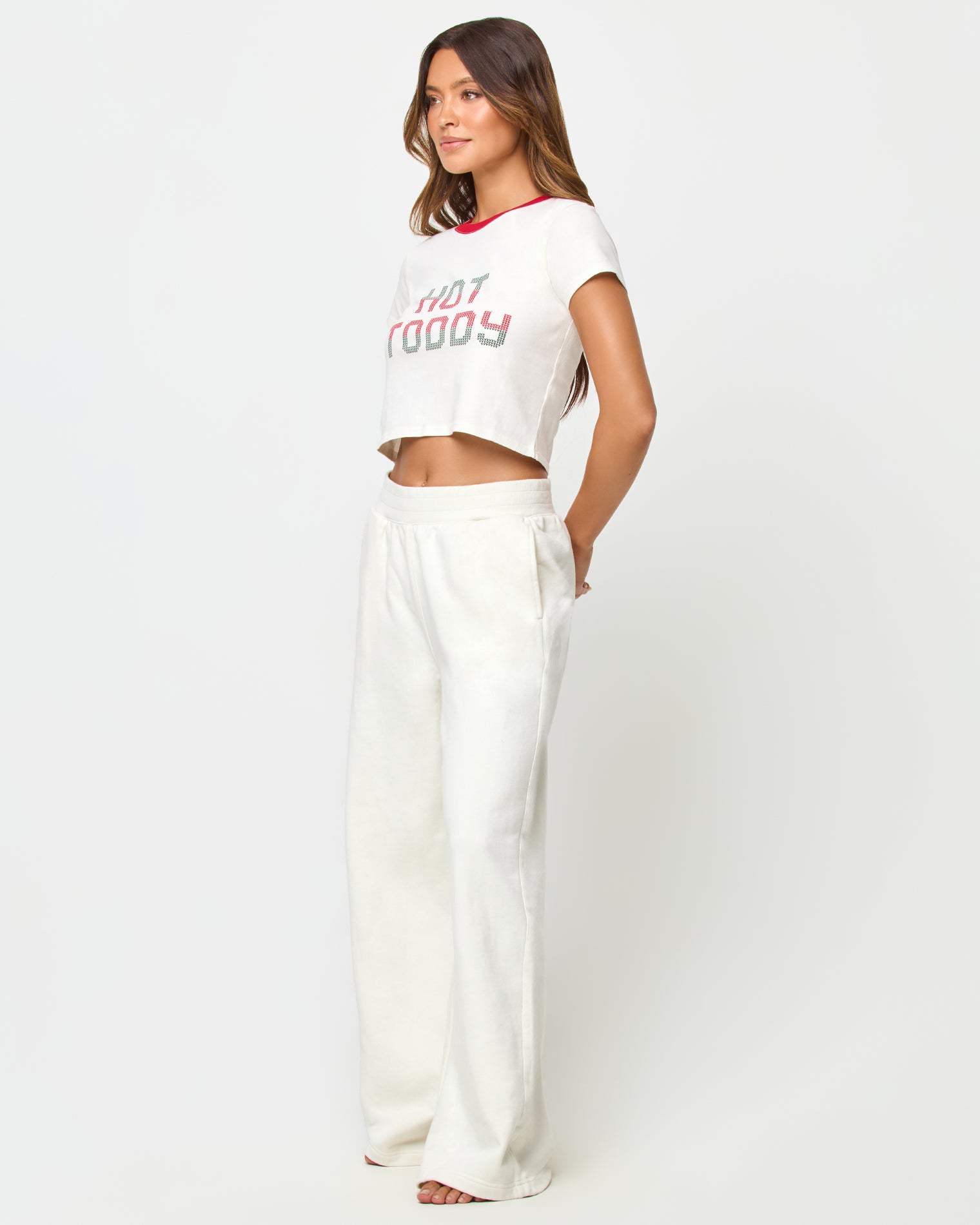 Merci Baby Tee - Hot Toddy LSPACE Merci baby tee in Hot Toddy print, three-quarter view on model.