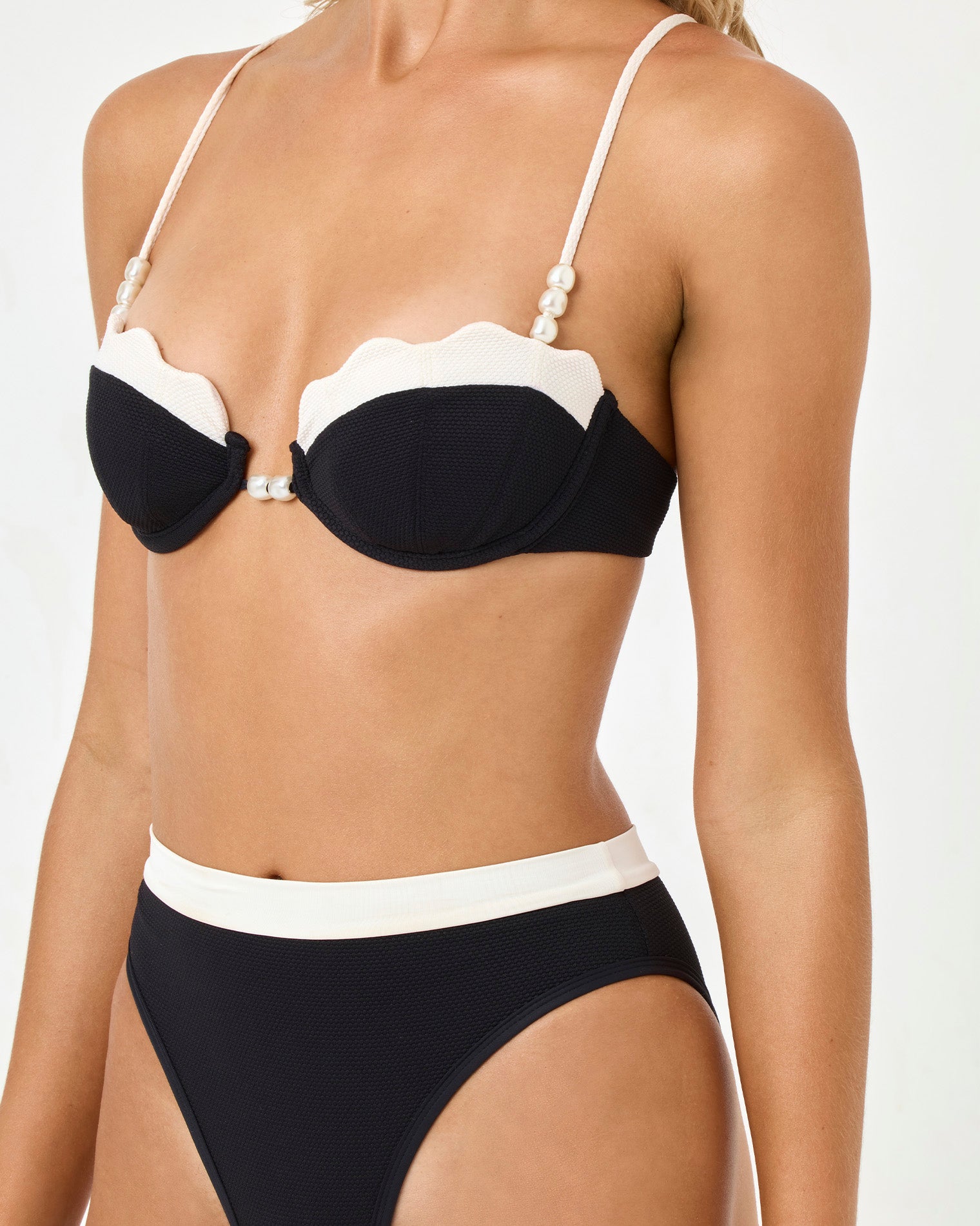 Sunrise Shell Bikini Top - Black-Cream Black and white bikini on a model against a white background