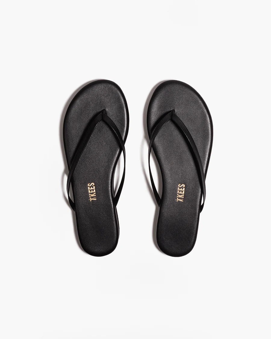 TKEES Lily Platform Sandals - Black Top-down view of both black TKEES Lily Platform Sandals with TKEES logo on footbed.