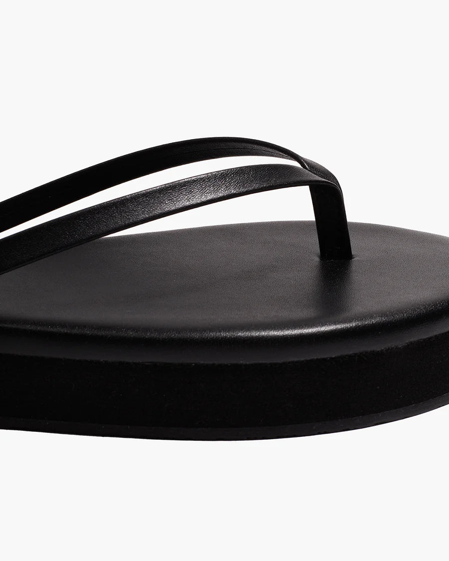TKEES Lily Platform Sandals - Black Close-up of the black thong strap and platform footbed detail on the TKEES Lily Platform Sandals.