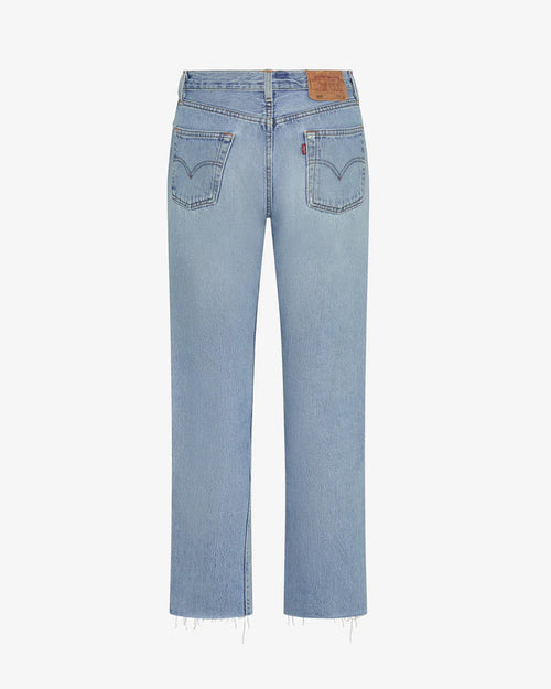 Back off-model view of the aligrace Relaxed Raw Jean in light wash, showing the classic back pockets, brand label, and raw unfinished hem.