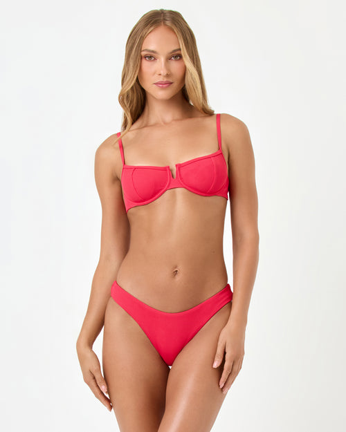 Front view of a model wearing the LSPACE pout Rocky Bikini Bottom with the Hunter Bikini Top.