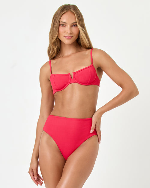 Front view of a model wearing the LSPACE pout Soleil Bikini Bottom with the Hunter Bikini Top.