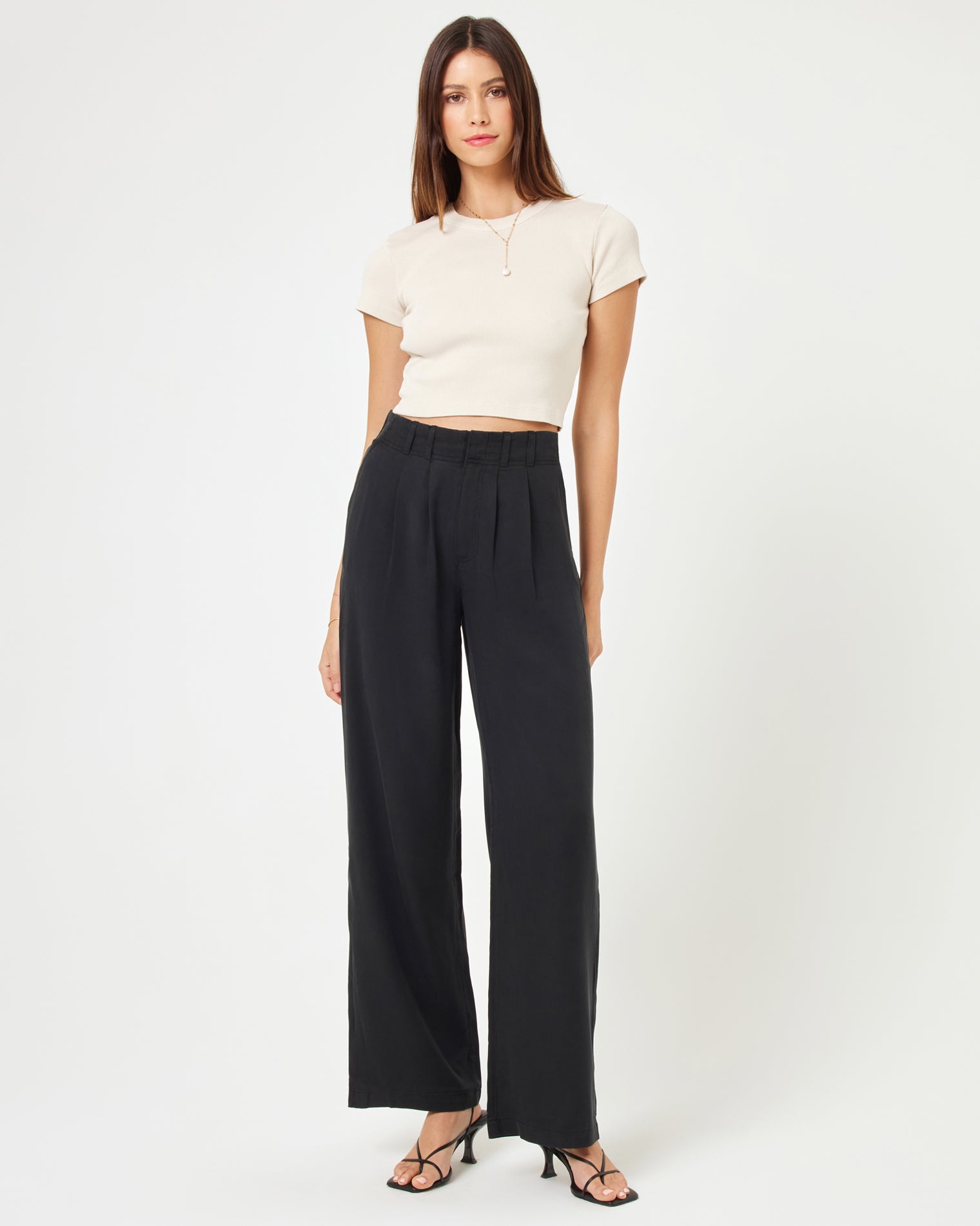 Rhodes Pant - Black Front view of model wearing the Rhodes Pant in black paired with a basic white tee.