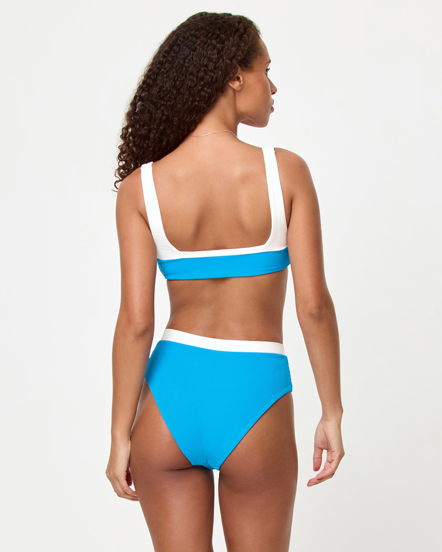 Misha Bikini Bottom - Electric Blue Cream Electric Blue Cream | Badge:New Arrival_#B2AC88_#ffffff'
LSPACE Zuri Bikini Top and Misha Bikini Bottom in electric blue cream, back view on model.