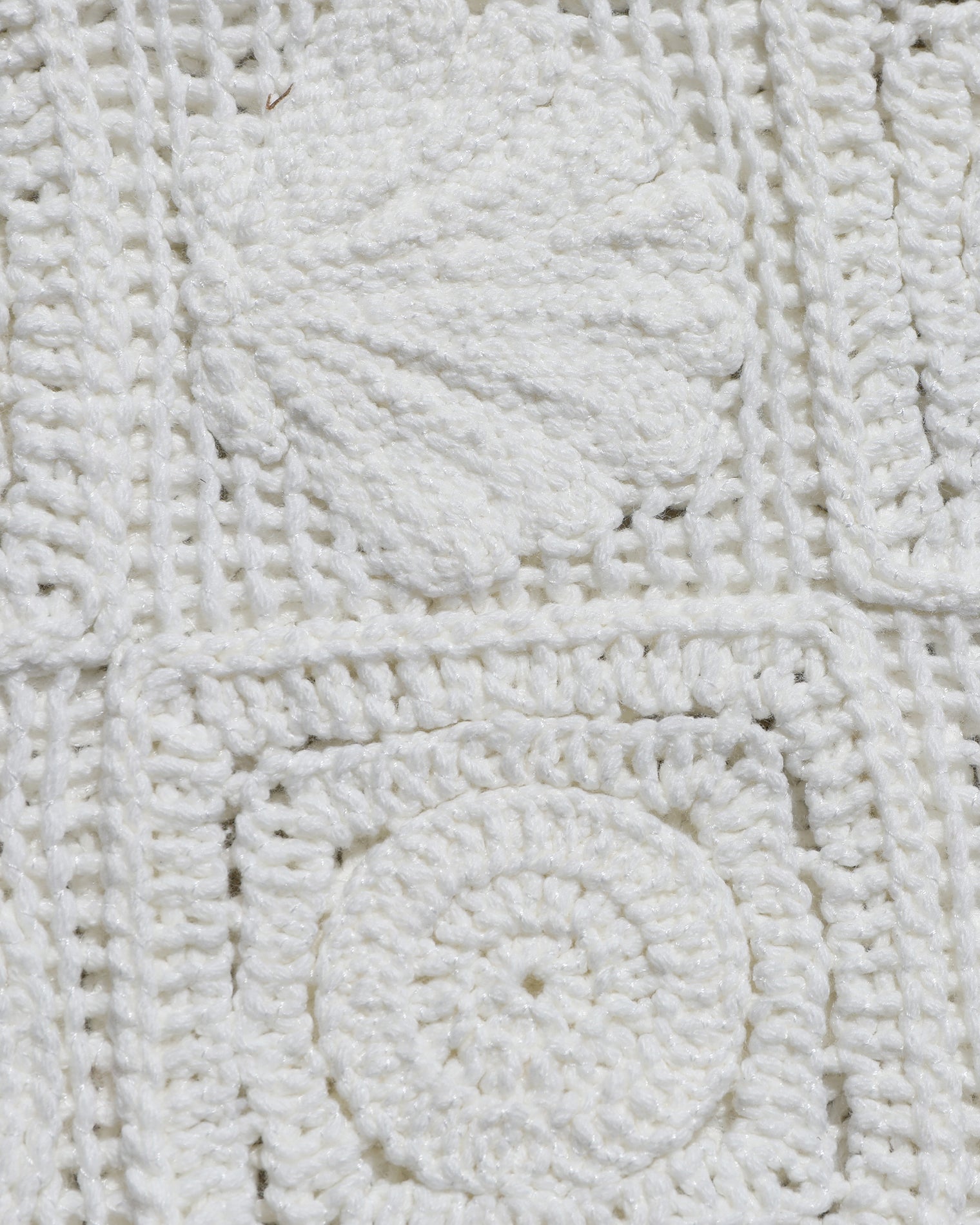 Calla Dress Close-up of the LSPACE Calla Dress in cream, showing the textured crochet granny-square fabric detail with circular raised motifs.