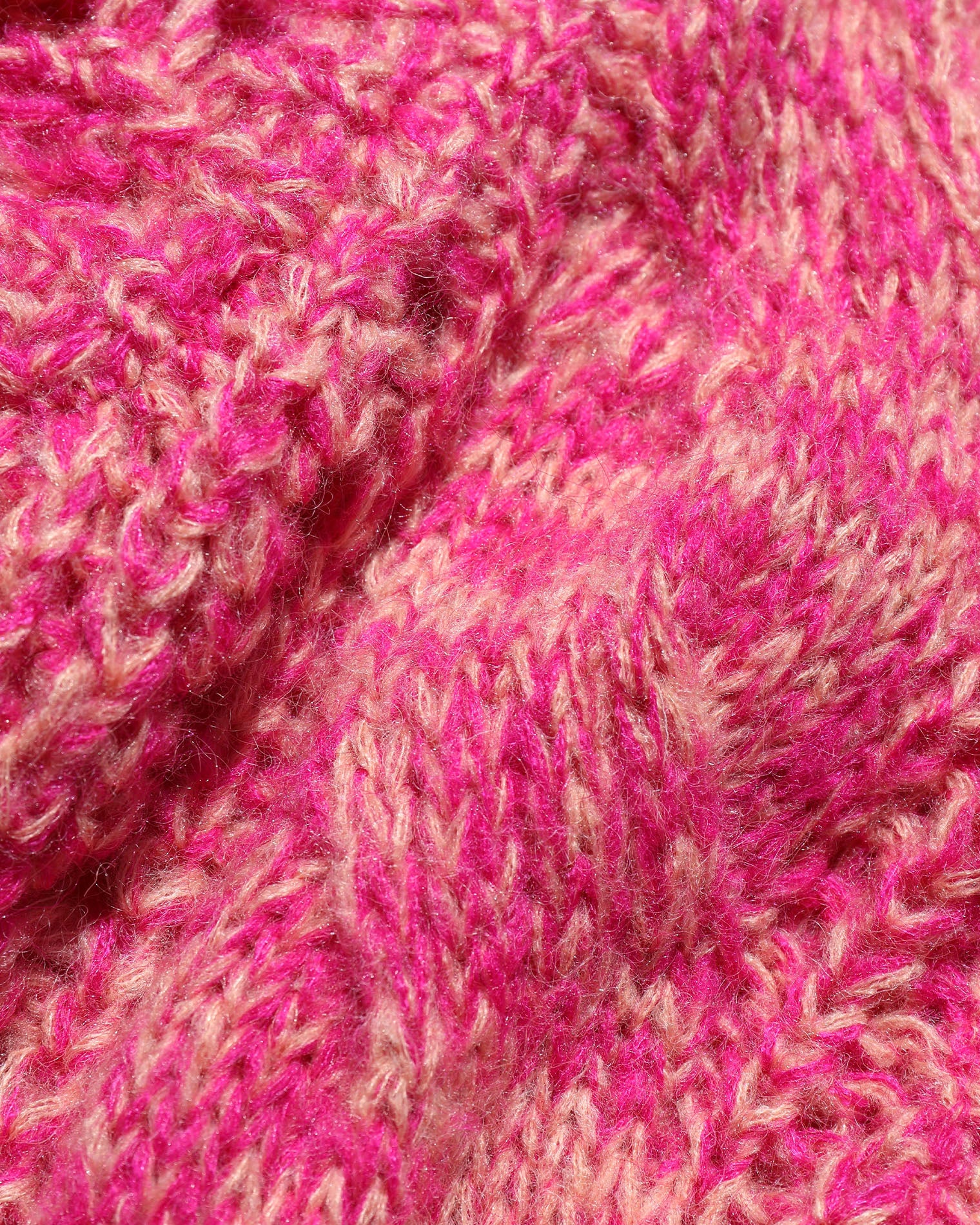 Strawberry Fields Cardigan - Strawberry Marl Close-up of the LSPACE Strawberry Fields Cardigan in strawberry marl, showing the marled pink and cream cable-knit yarn texture in detail.