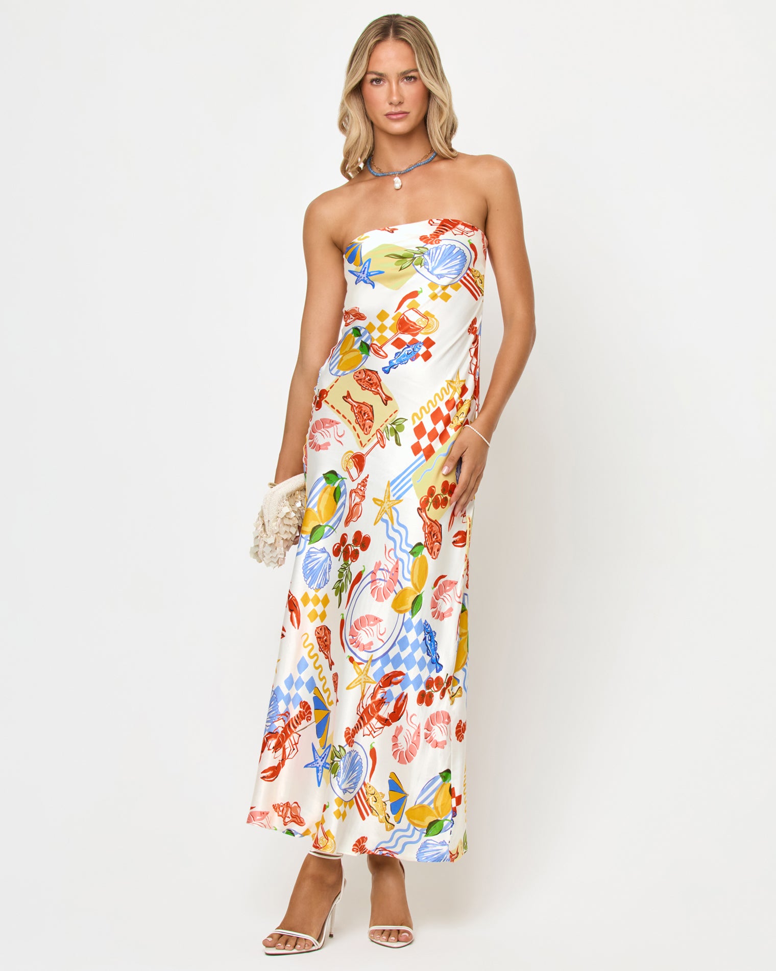 Spring In Love Dress - Seaside Soiree Front view of a model wearing the LSPACE Spring In Love Dress in seaside soiree, a strapless satin maxi dress with a colorful seaside print featuring lobsters, shells, and starfish.