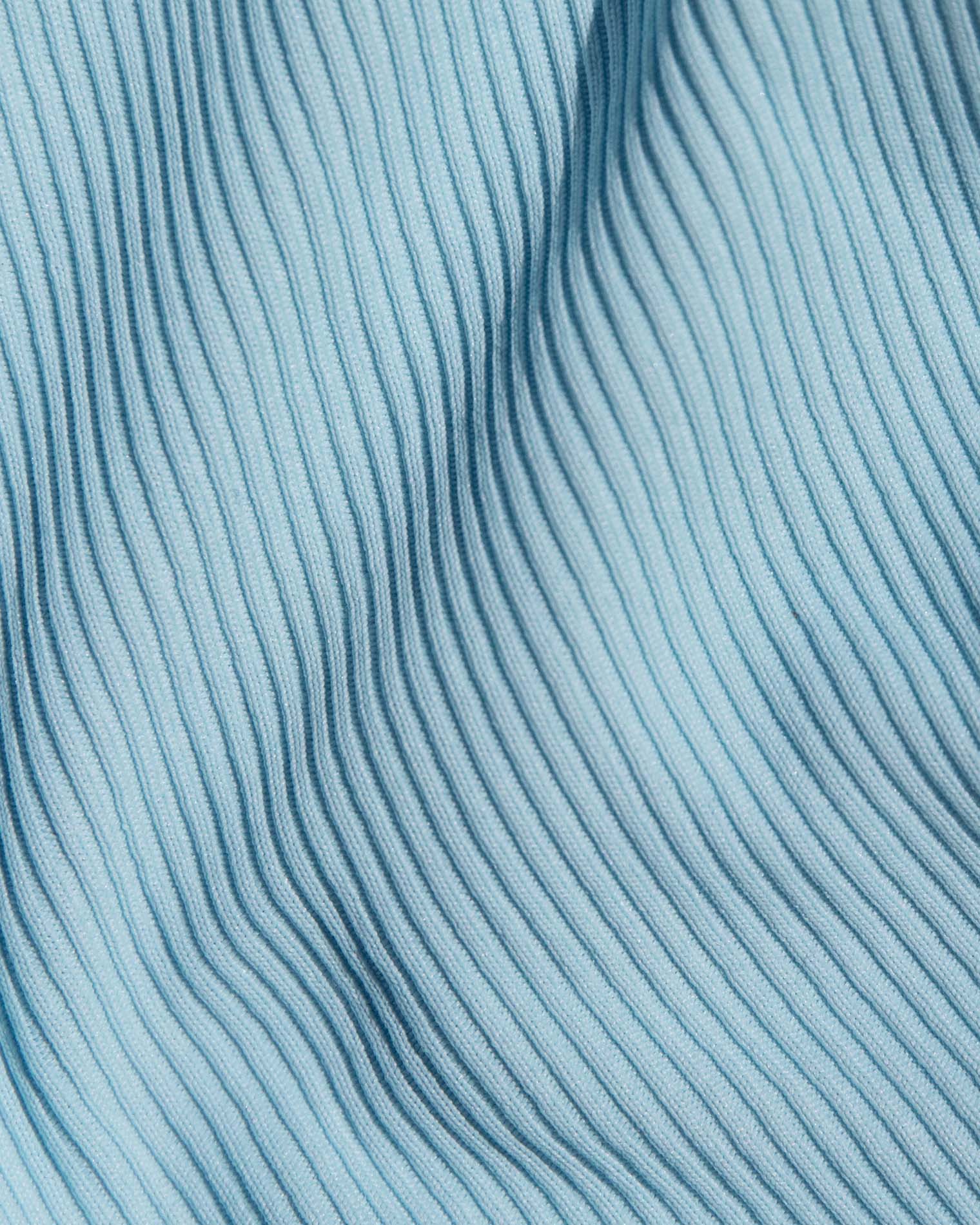 Daria Bikini Top - Sky Blue Cream A close-up of a light blue ribbed knit fabric.