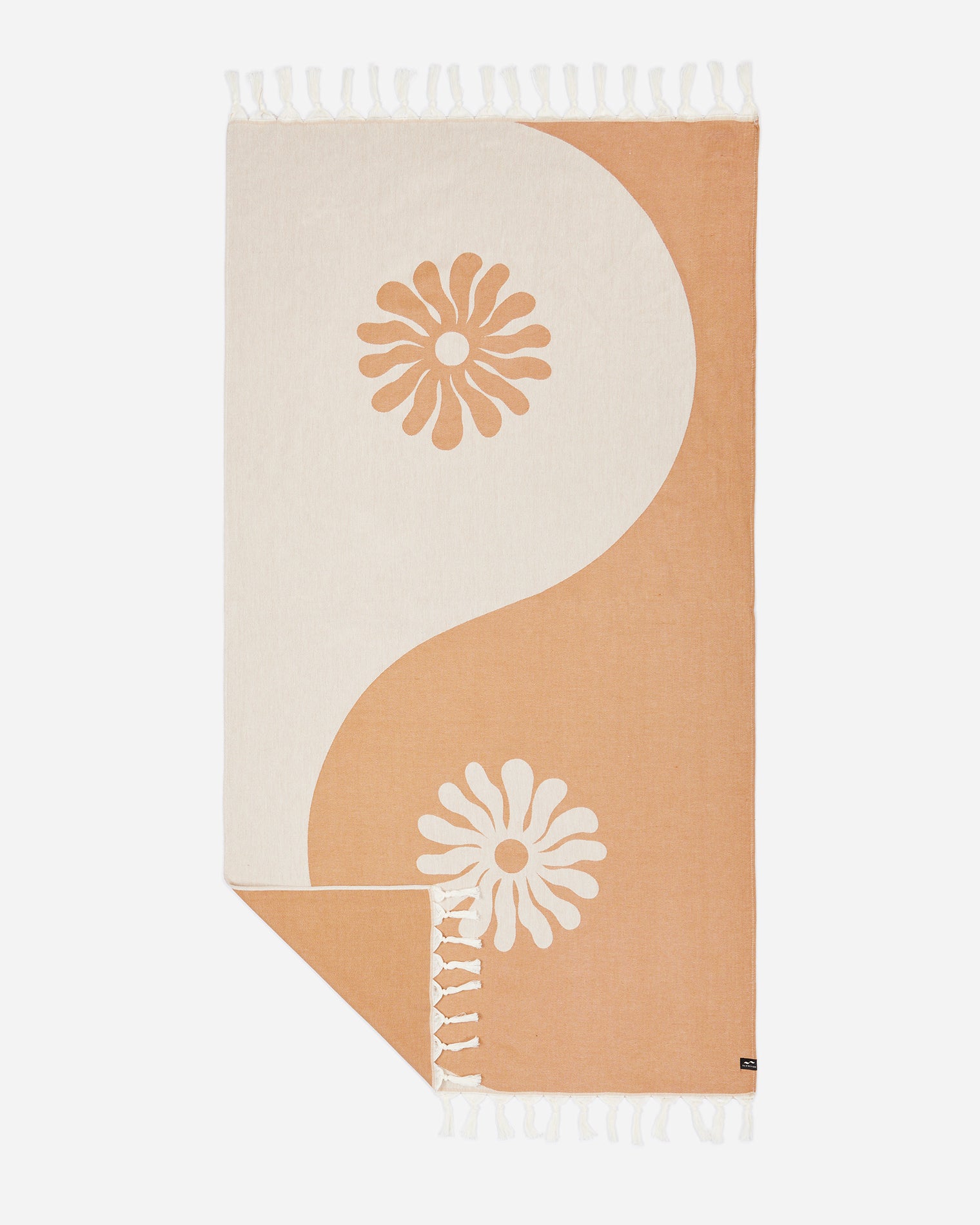 Slowtide Botanic Balance Turkish Towel - Brush Flat lay of the Slowtide Botanic Balance Turkish Towel in brush, showing a yin-yang inspired pattern in warm tan and cream with daisy flower motifs and fringe detail.