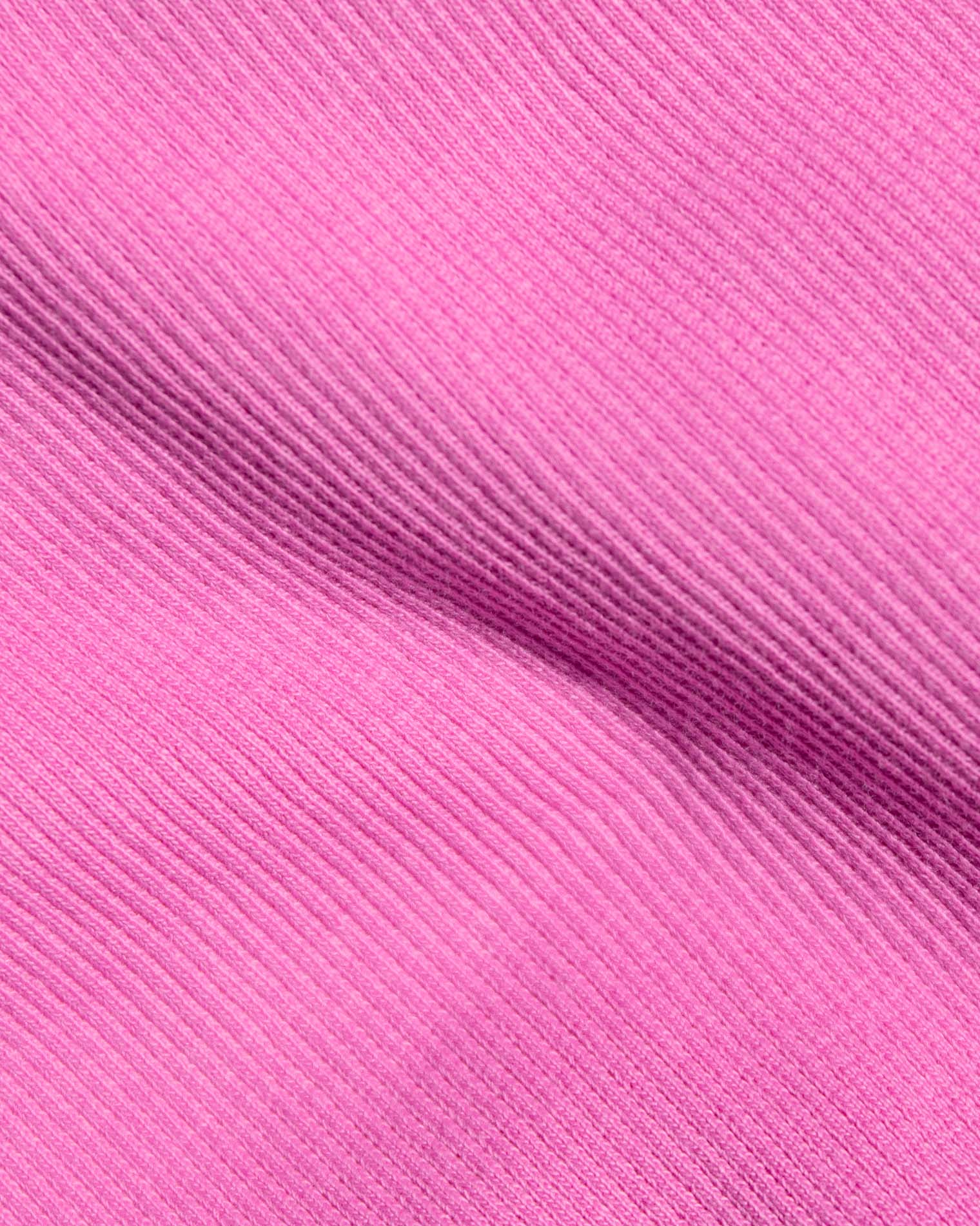 Leigh Tank - Sweetheart A close-up of bright pink ribbed fabric.
