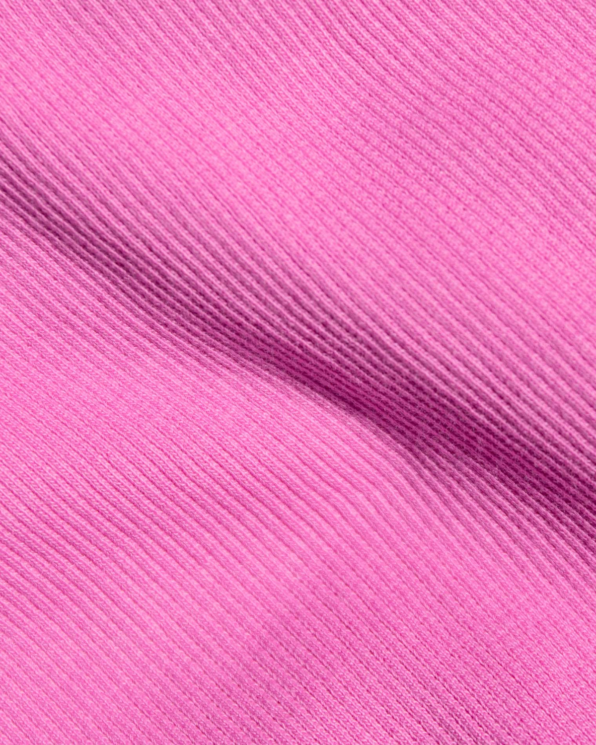 Leigh Tank - Sweetheart A close-up of bright pink ribbed fabric.
