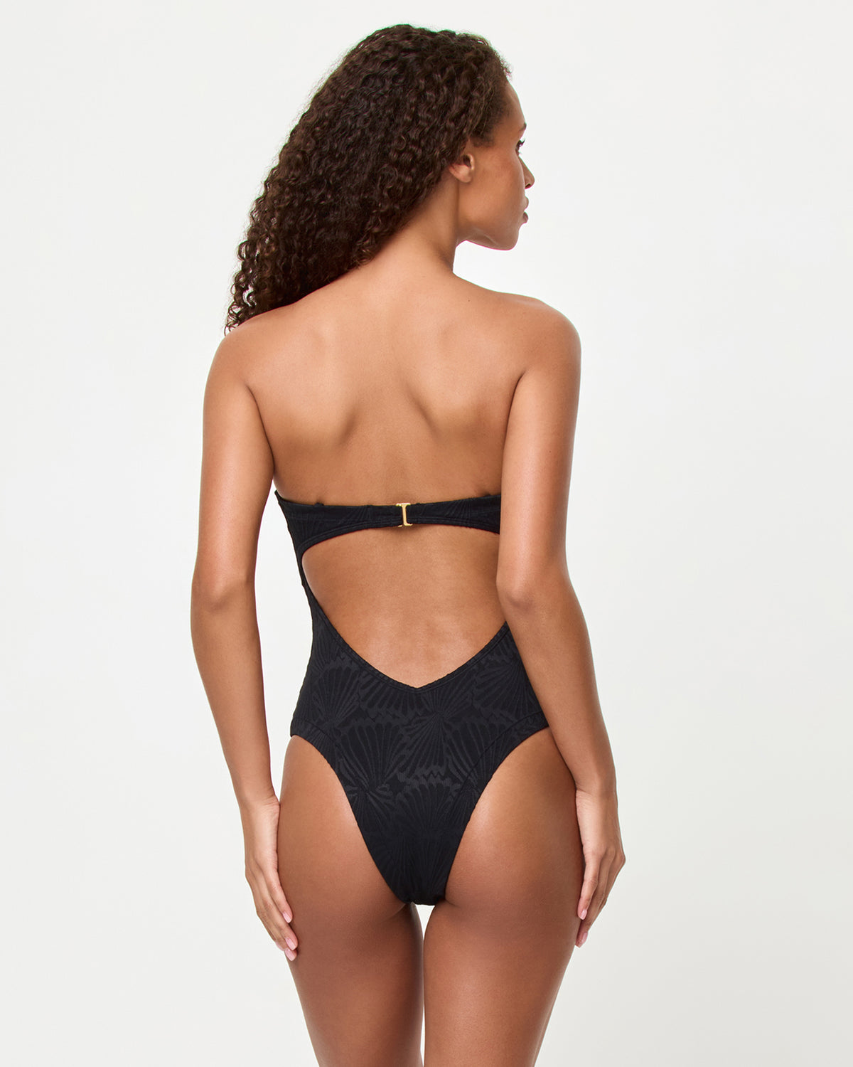 La Femme One Piece Swimsuit - Black Shellpress LSPACE La Femme one piece swimsuit in Black Shellpress print, side view on model.