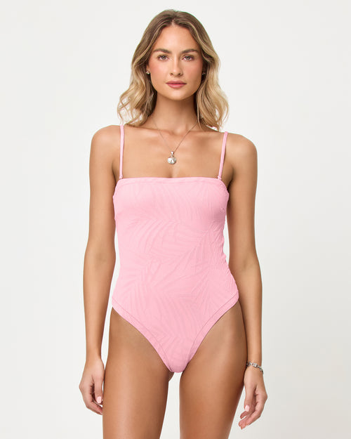 
LSPACE La Femme one piece swimsuit in Pink Sugar, front view on model with straps.