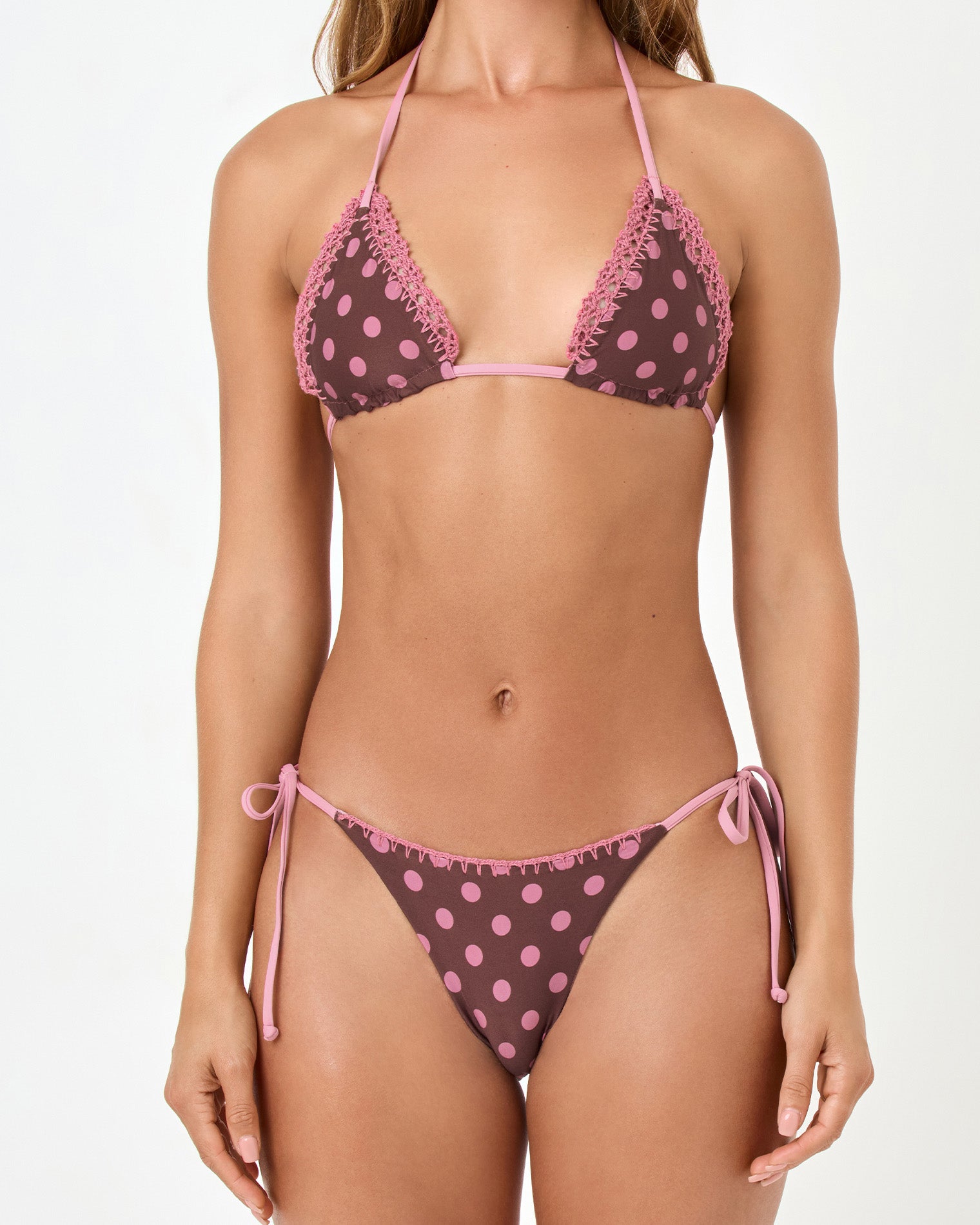 Samba Bikini Bottom - Stripe-Dot Woman wearing a polka dot bikini with pink and brown pattern on a white background