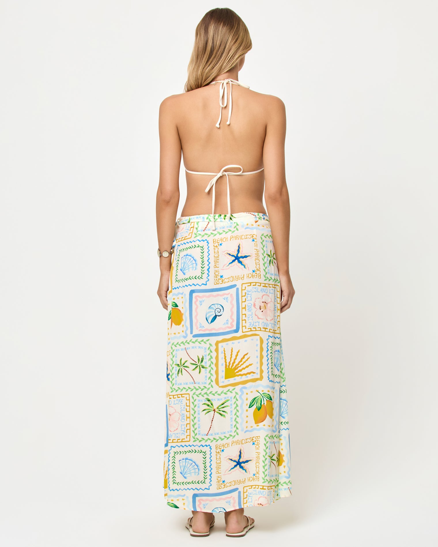 Ever Wrap Skirt - Wish You Were Here LSPACE Ever Wrap Skirt in Wish You Were Here print, back view on model with matching bikini halter top.