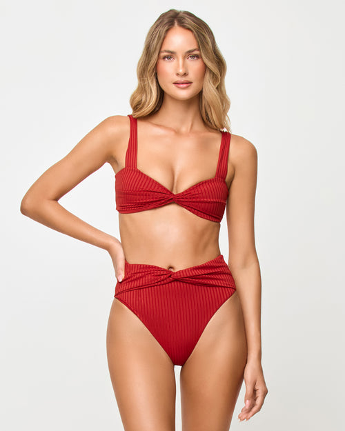 LSPACE Lana bikini top in redwood, three-quarter view on model.