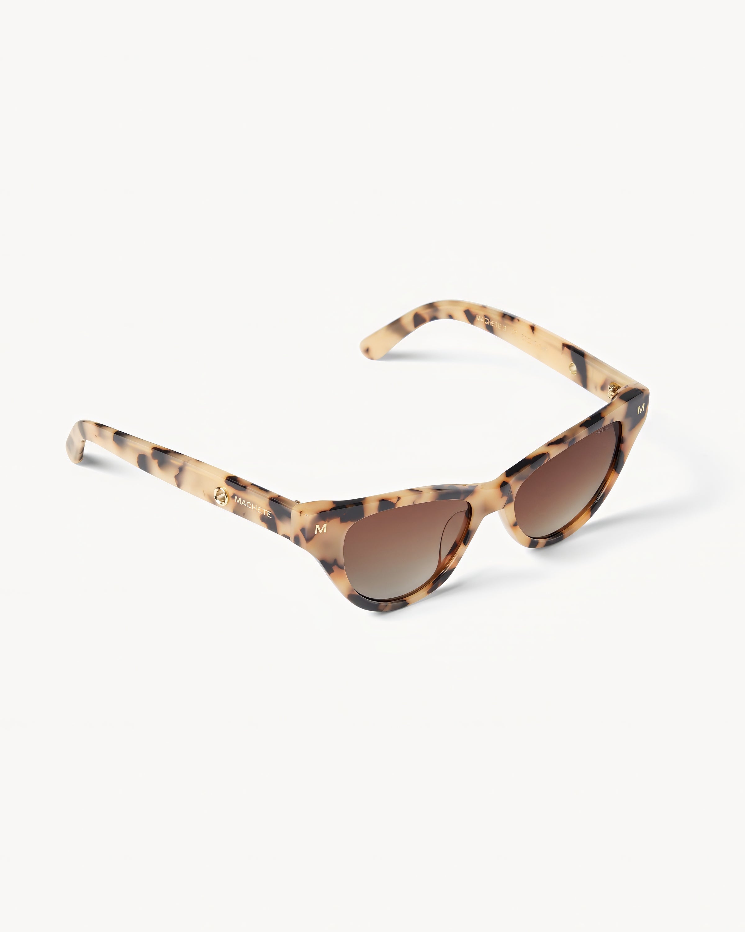 Machete Suzy Sunglasses - Blonde Tortoise Off-model angled view of the Machete Suzy Sunglasses in blonde tortoise showing the side profile of the cat-eye frame.