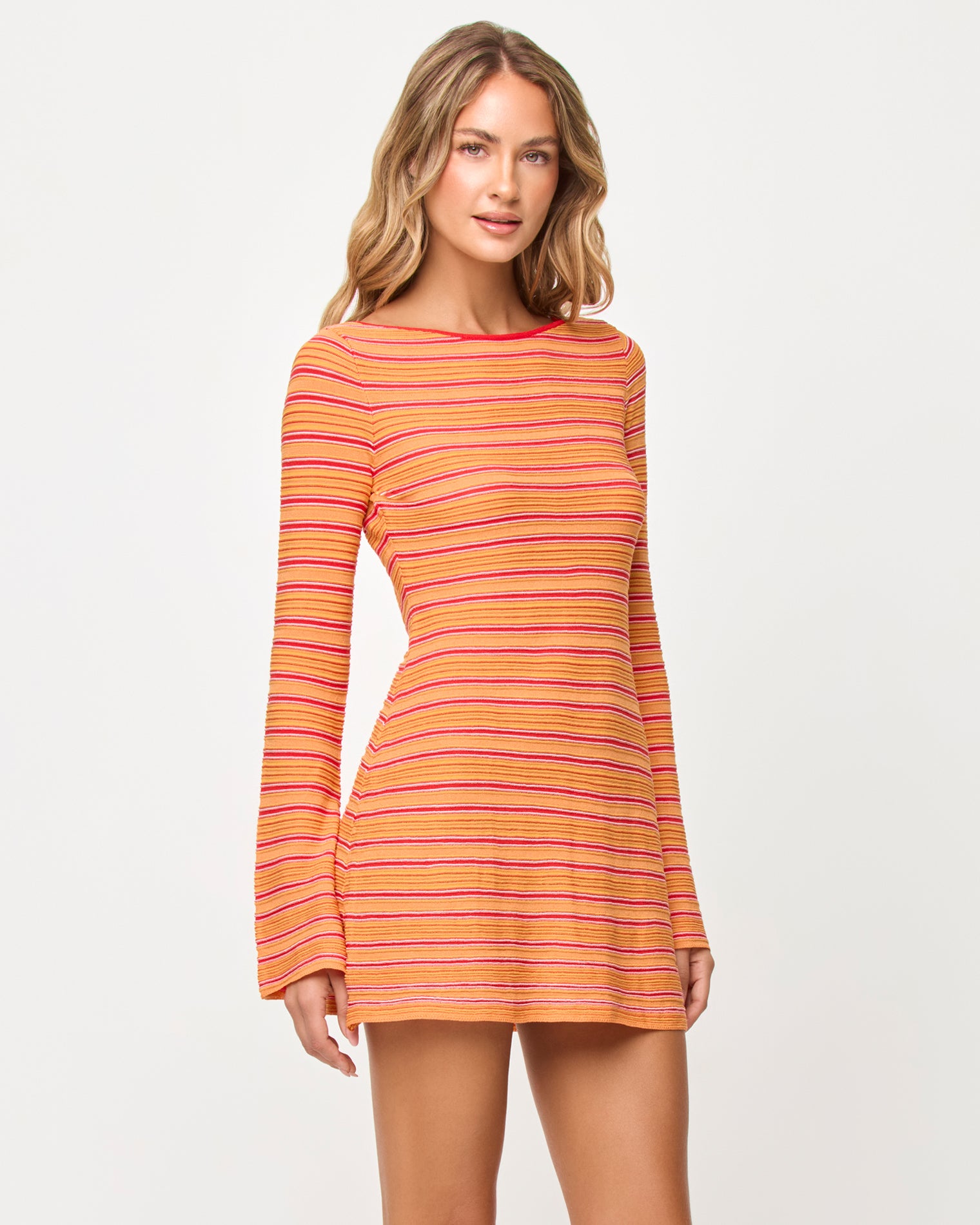 x The Salty Blonde Tita Dress - Chili Pepper Stripe Side view of model wearing the LSPACE x The Salty Blonde Tita Dress in chili pepper stripe.
