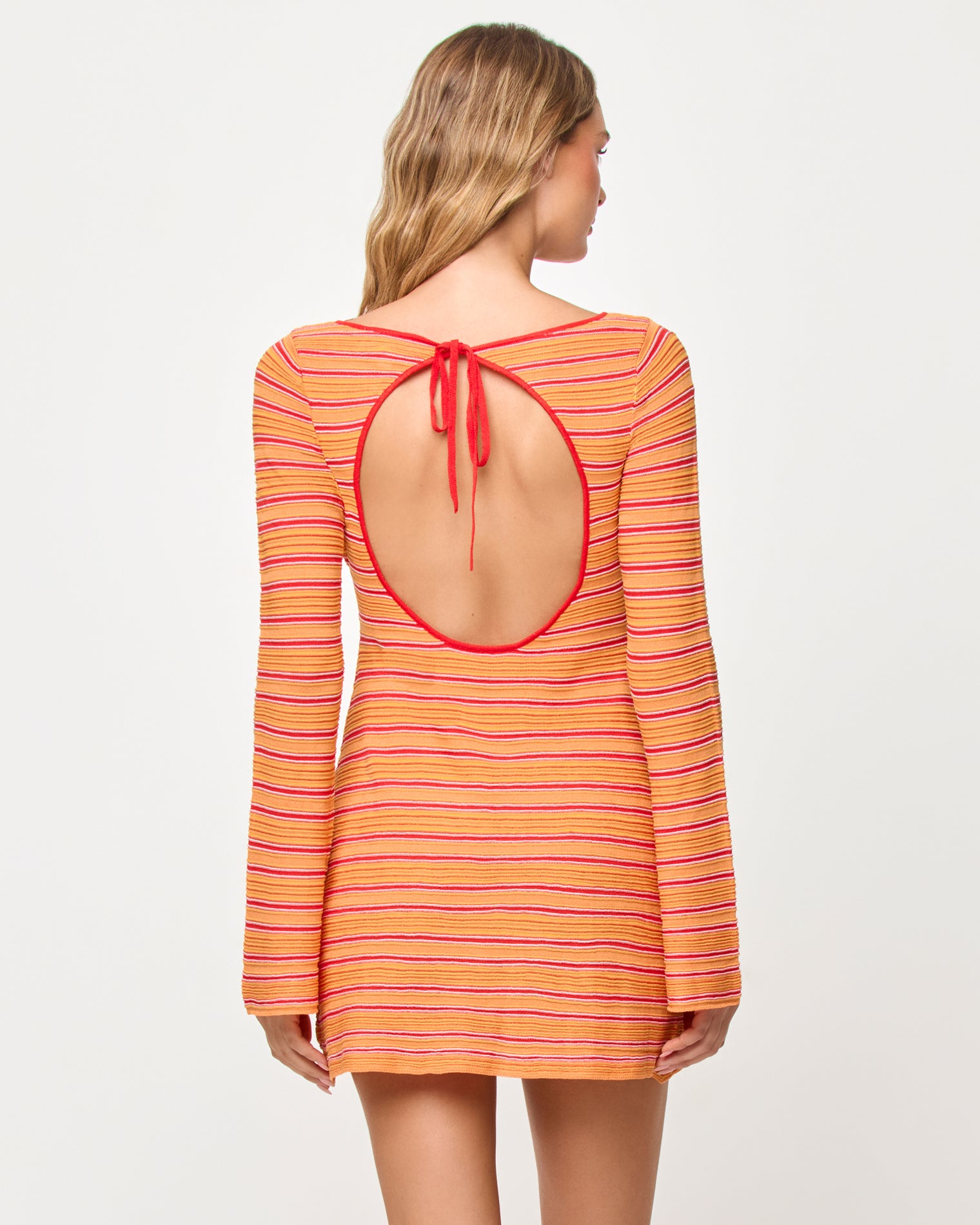 x The Salty Blonde Tita Dress - Chili Pepper Stripe Back view of model wearing the LSPACE x The Salty Blonde Tita Dress in chili pepper stripe.