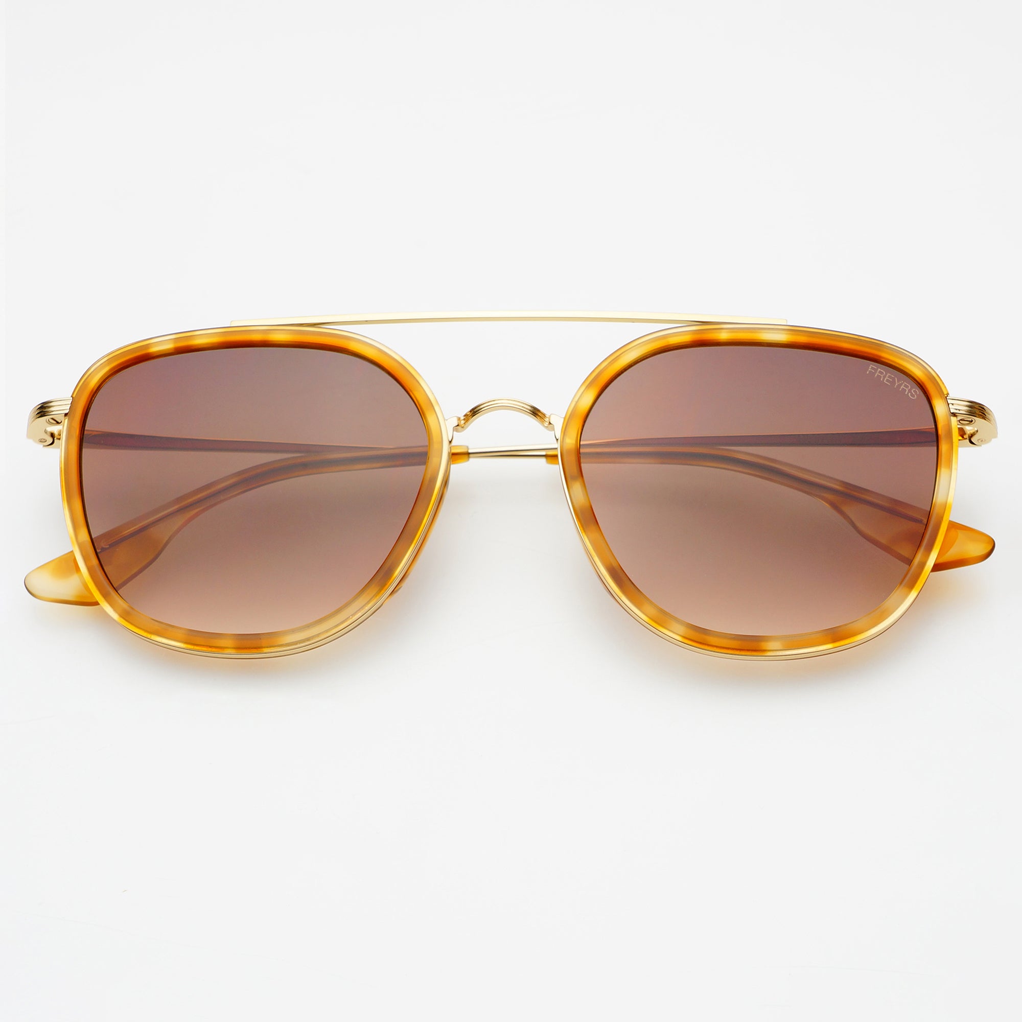 Freyrs Weston Sunglasses - Light Tortoise Off-model image of the Freyrs Weston Sunglasses in light tortoise, showing an aviator-style light tortoise acetate frame with a gold metal double bridge bar and brown gradient lenses.