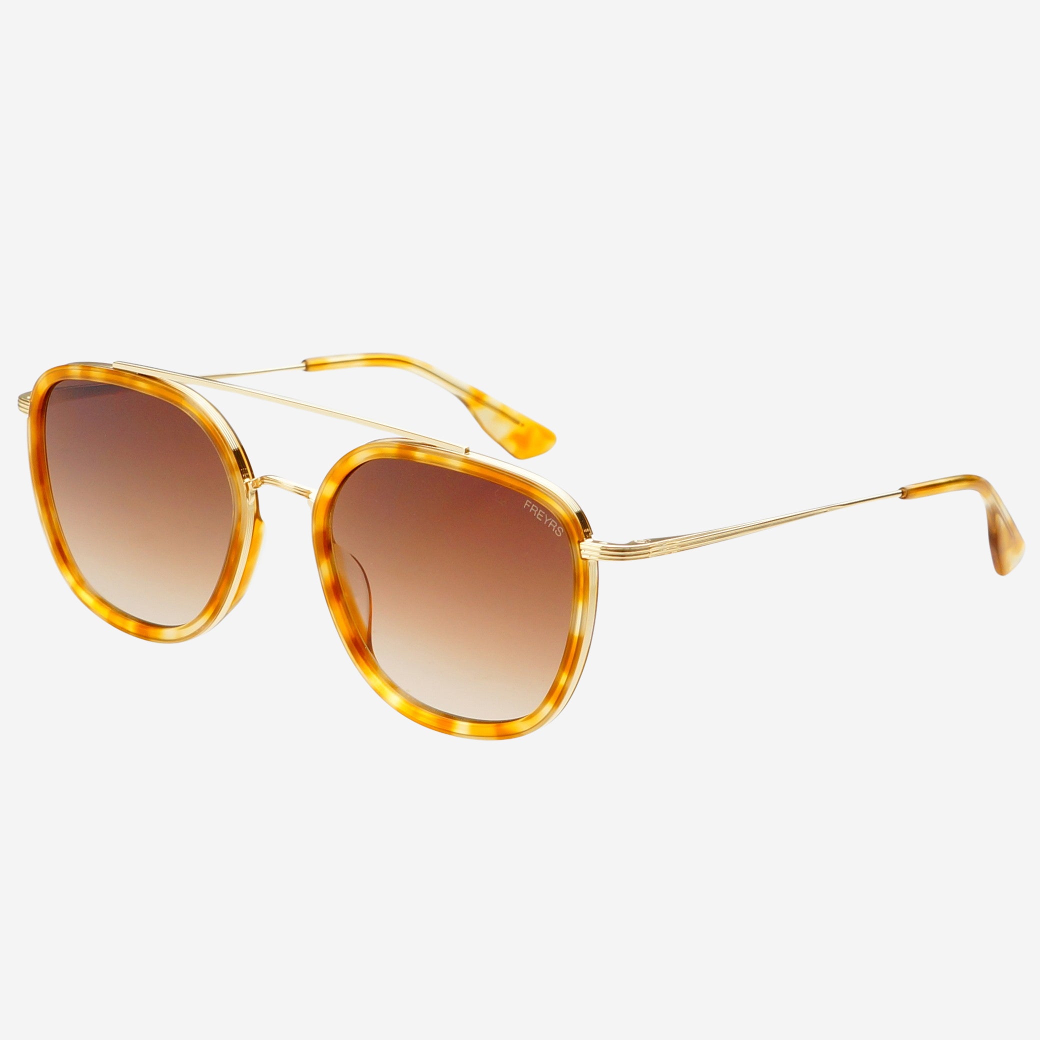Freyrs Weston Sunglasses - Light Tortoise Off-model angled view of the Freyrs Weston Sunglasses in light tortoise showing the light tortoise acetate frame, gold metal double bridge, thin gold arms with tortoise tips, and brown gradient lenses.