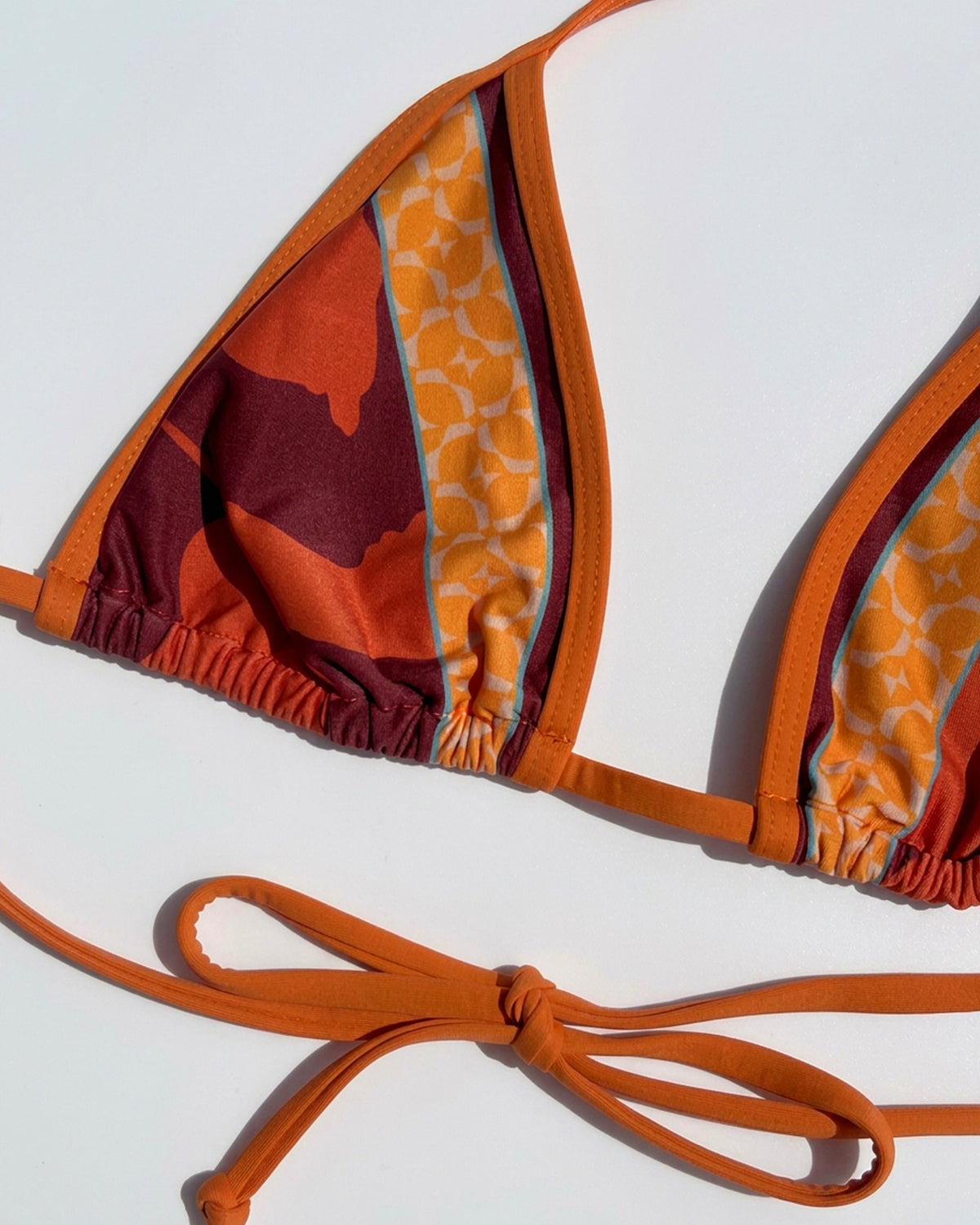 Aspen Bikini Top - Cocobolo Close up flat lay of the Aspen bikini Top in Cocobolo.