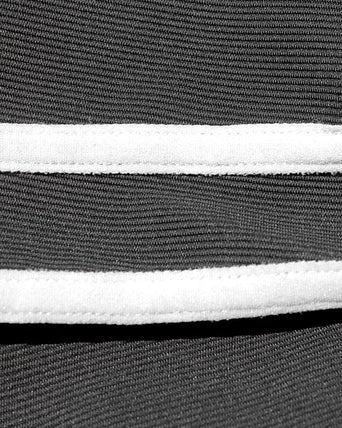 Sutton Pant - Black-Cream Close-up detail view of the LSPACE Sutton Pant in black-cream, highlighting the cream side stripe.