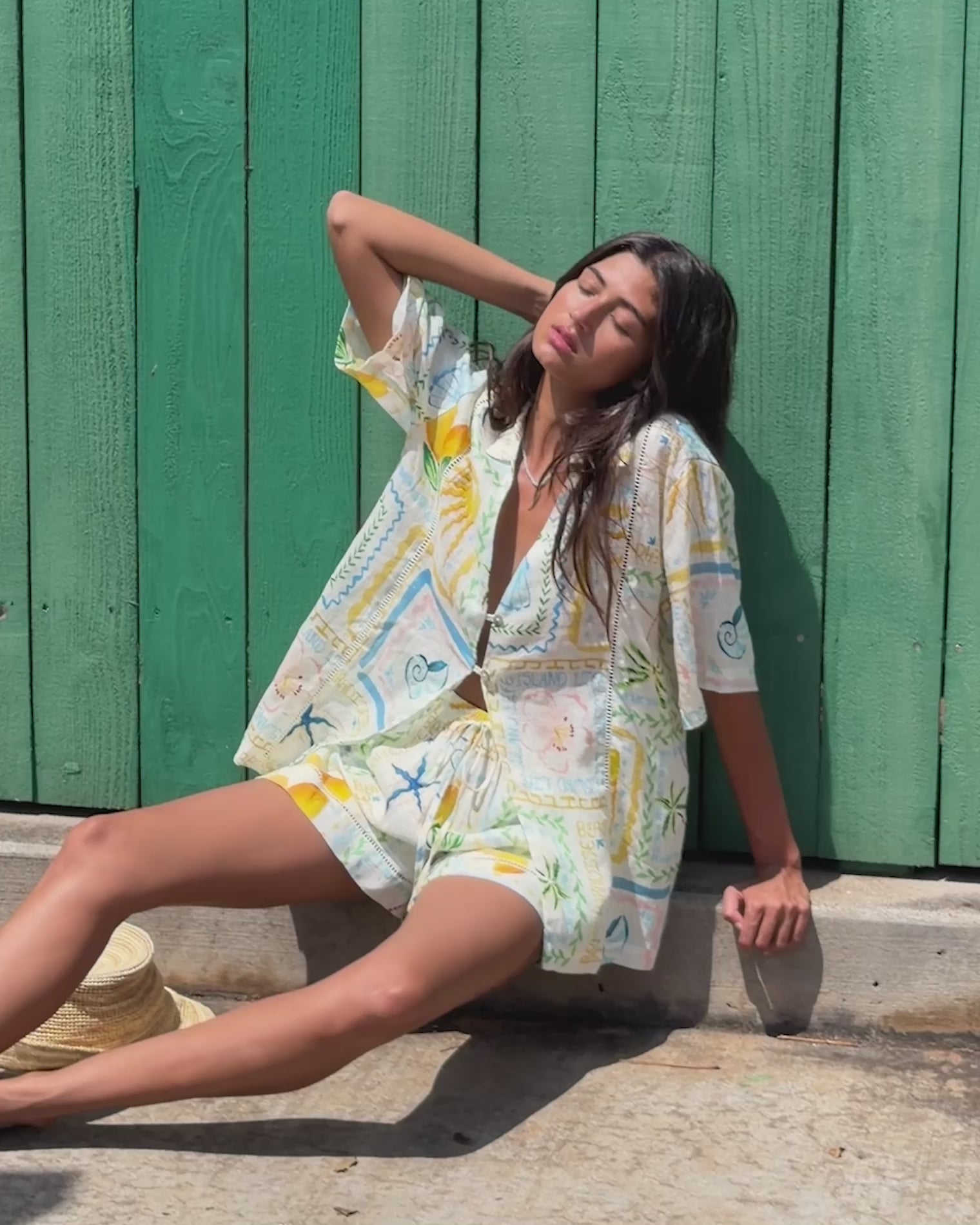 La Mer Shirt - Wish You Were Here Video of LSPACE La Mer Short and Shirt in Wish You Were Here print, lifestyle view on model.