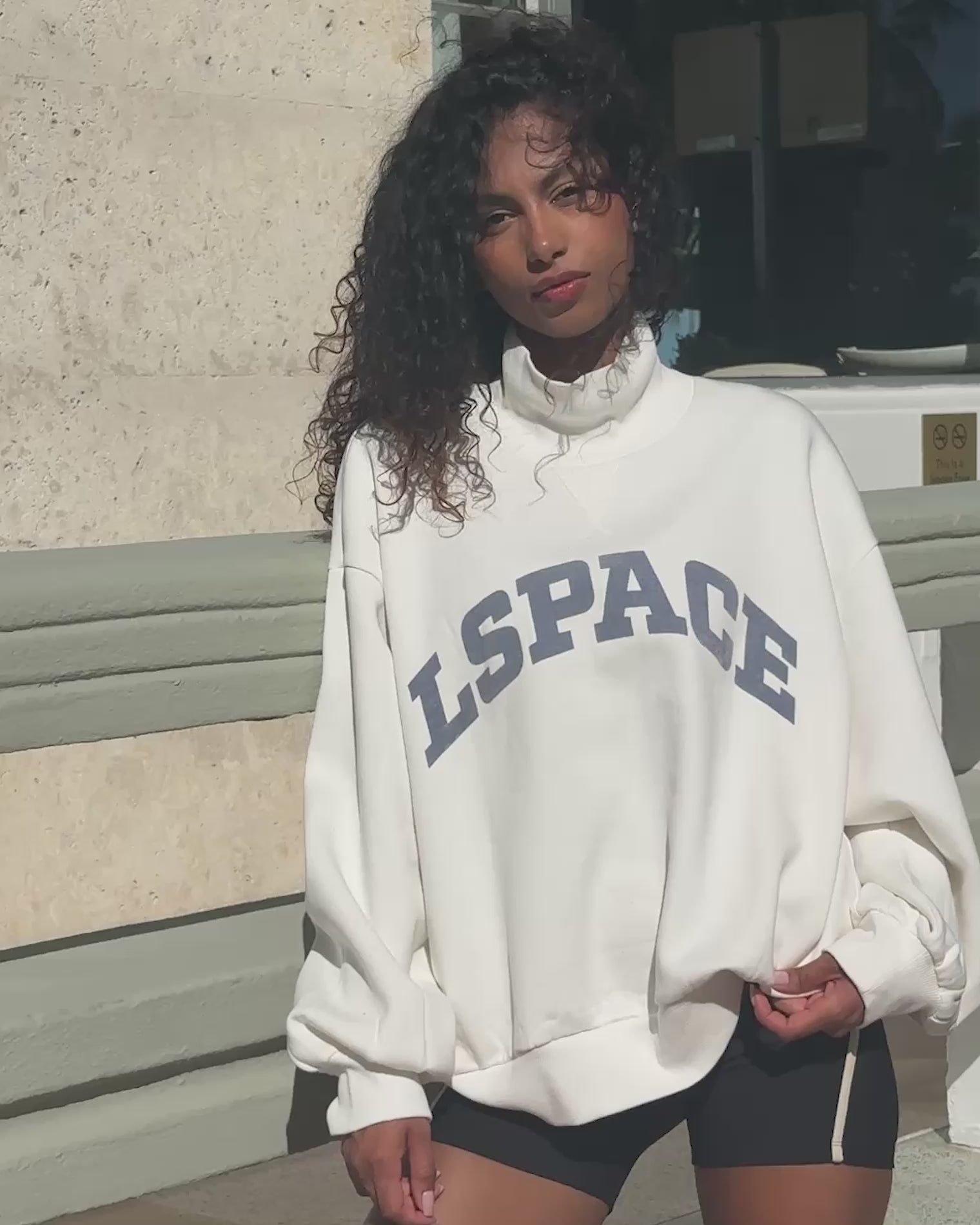 Crush Sweatshirt - Cream Video of model wearing Crush Sweatshirt in cream in outdoor setting.
