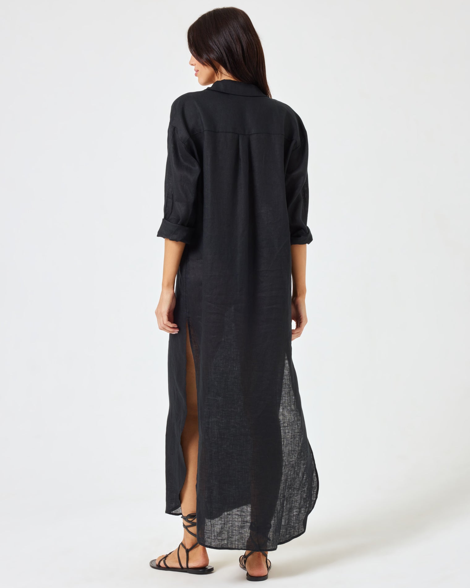 Capistrano Tunic - Black Back view of a model wearing the LSPACE Capistrano Tunic in black linen.