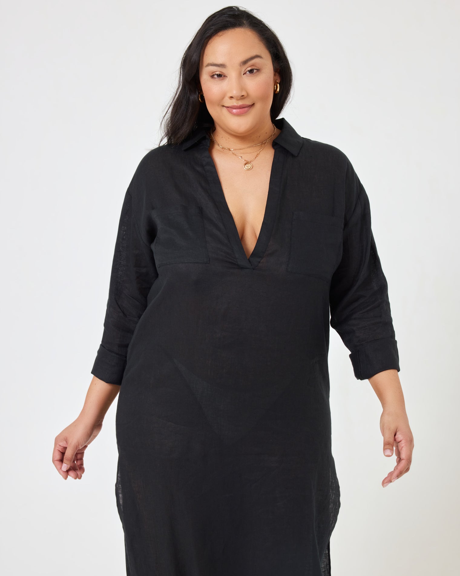 Capistrano Tunic - Black Close-up front view of a model wearing the LSPACE Capistrano Tunic in black, highlighting the deep V-neck collar detail.
