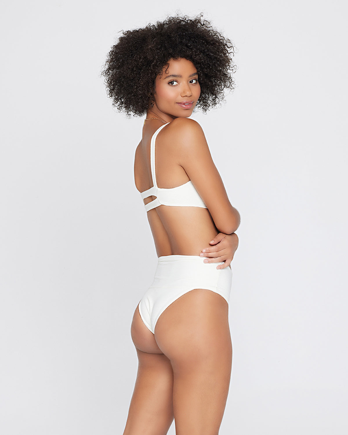 Eco Chic Repreve® Desi Bikini Bottom - Mediterranean Cream | Model: Valyn (size: S) Badge:Eco Chic_#B2AC88_#ffffff