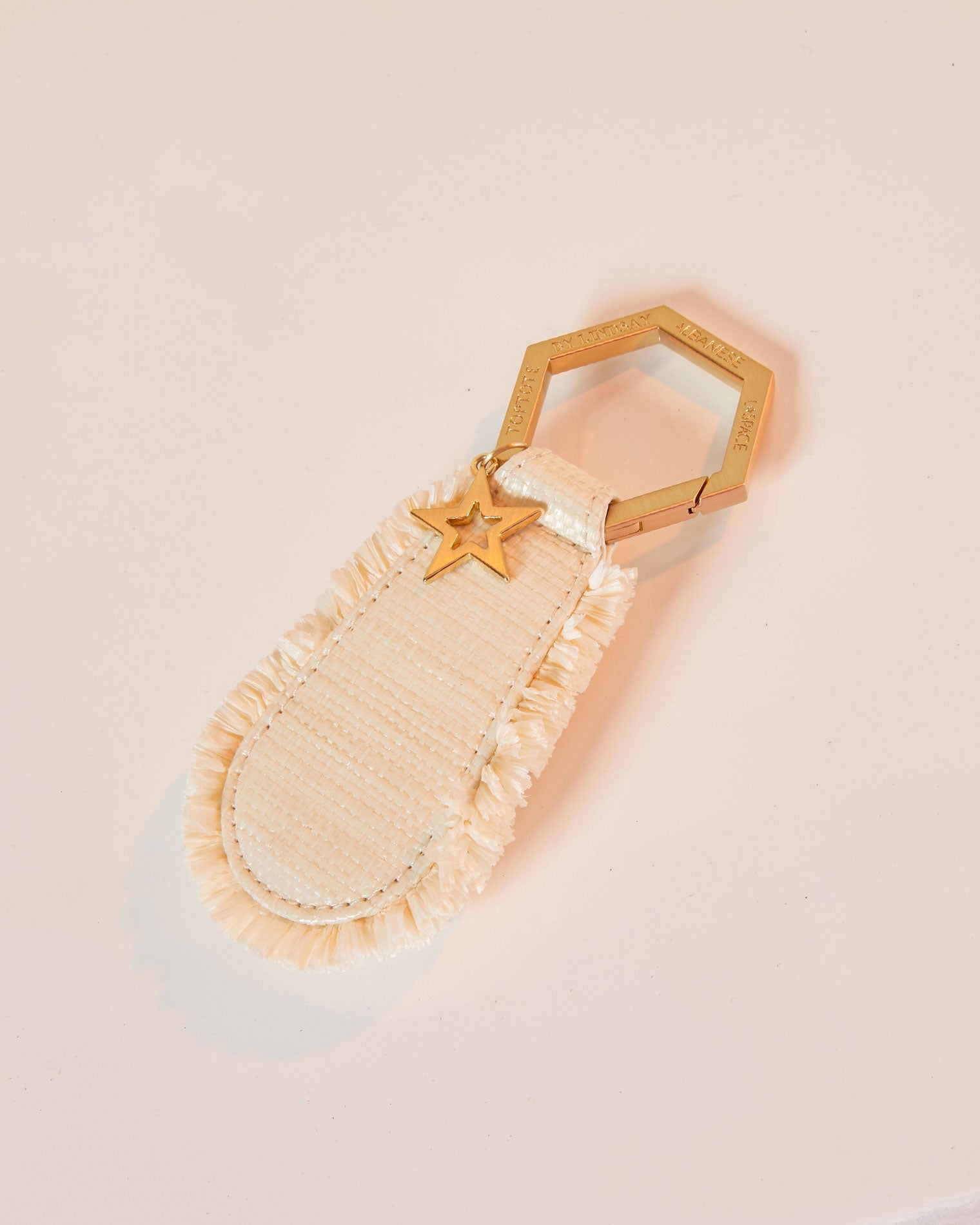 LSPACE x Lindsay Albanese TOPTOTE - Tobacco Off-model image of the LSPACE x Lindsay Albanese TOPTOTE in a natural colorway on a blush background.